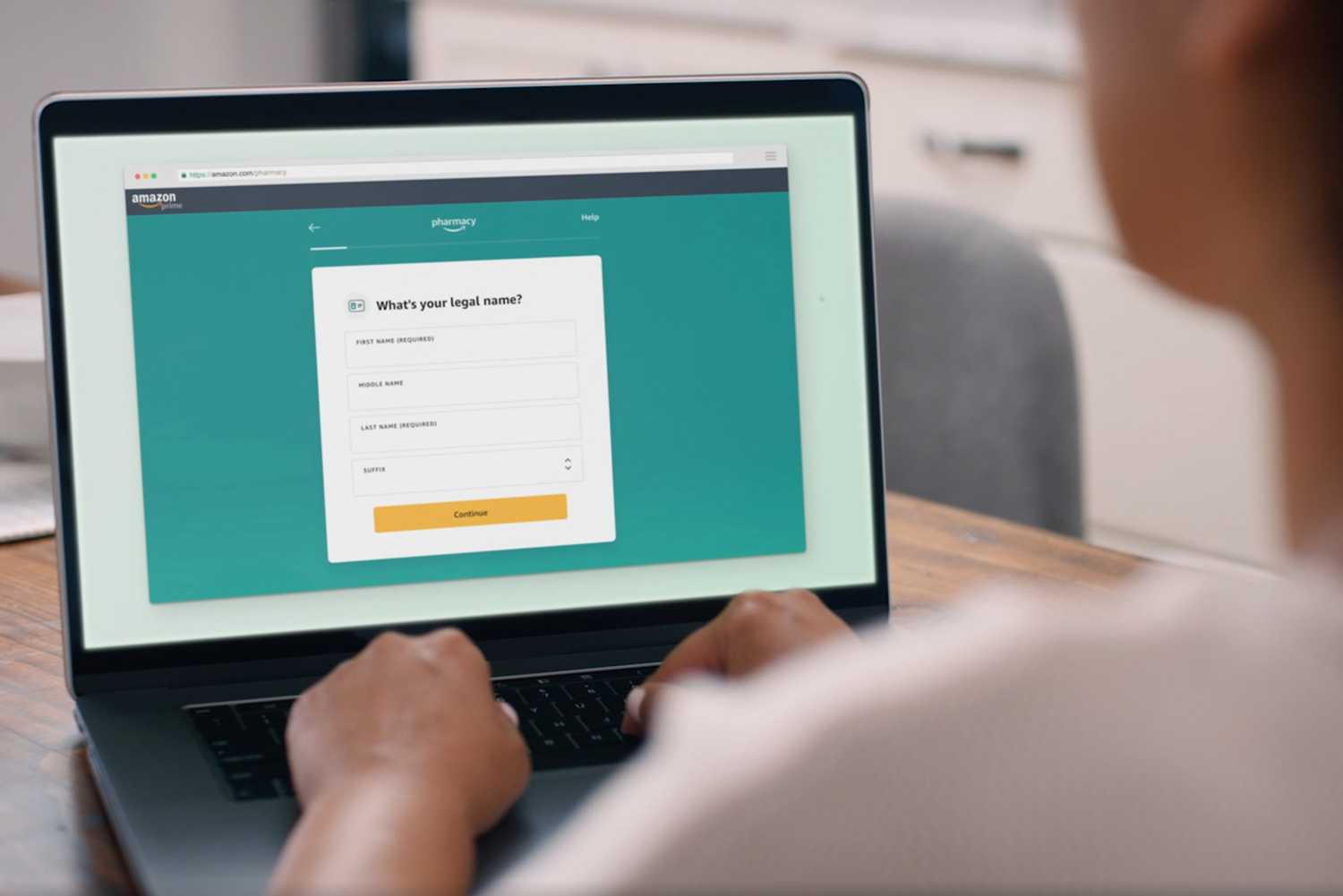 A person signing up for Amazon Pharmacy on a computer