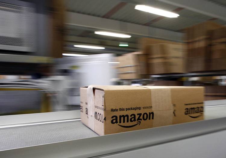 An Amazon box on an assembly line 
