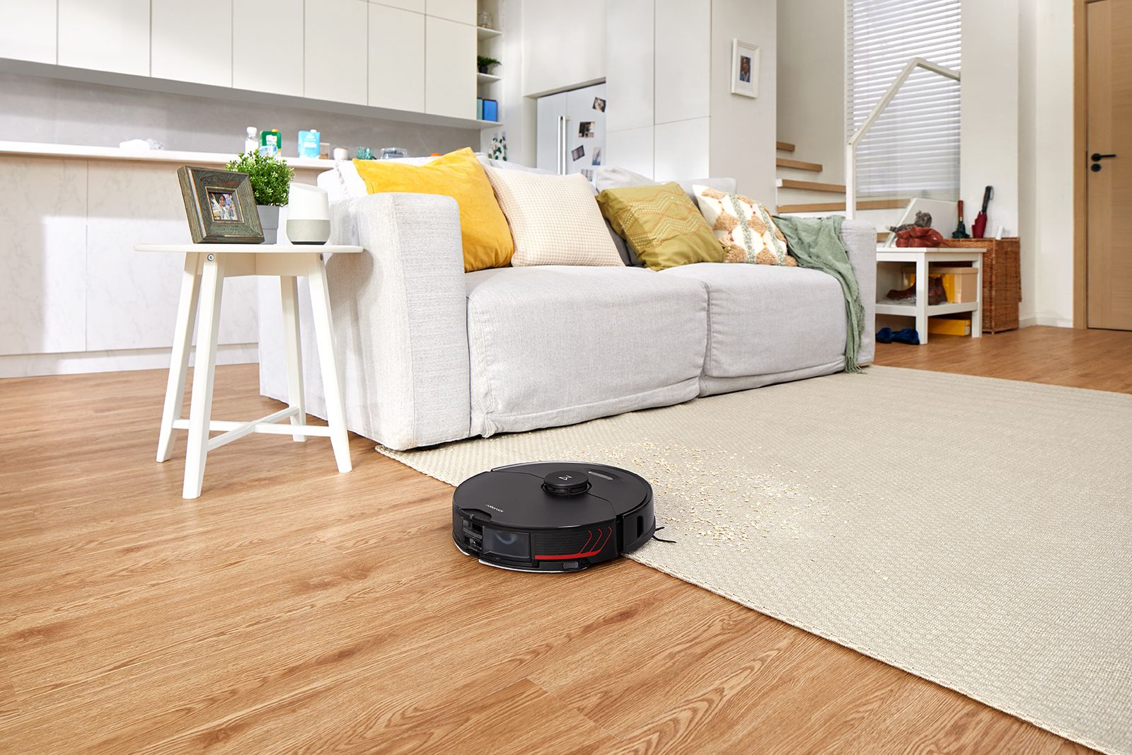 The Roborock S7 MaxV vacuum cleans a carpet and wood floor