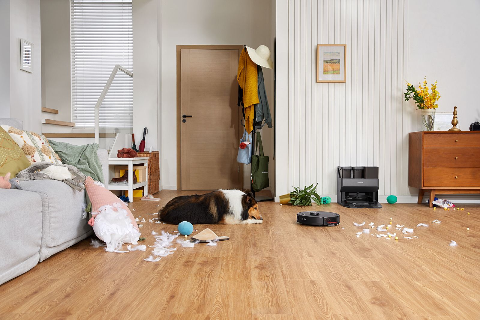The Roborock S7 MaxV Ultra vacuum cleans a big mess of feathers left by a dog