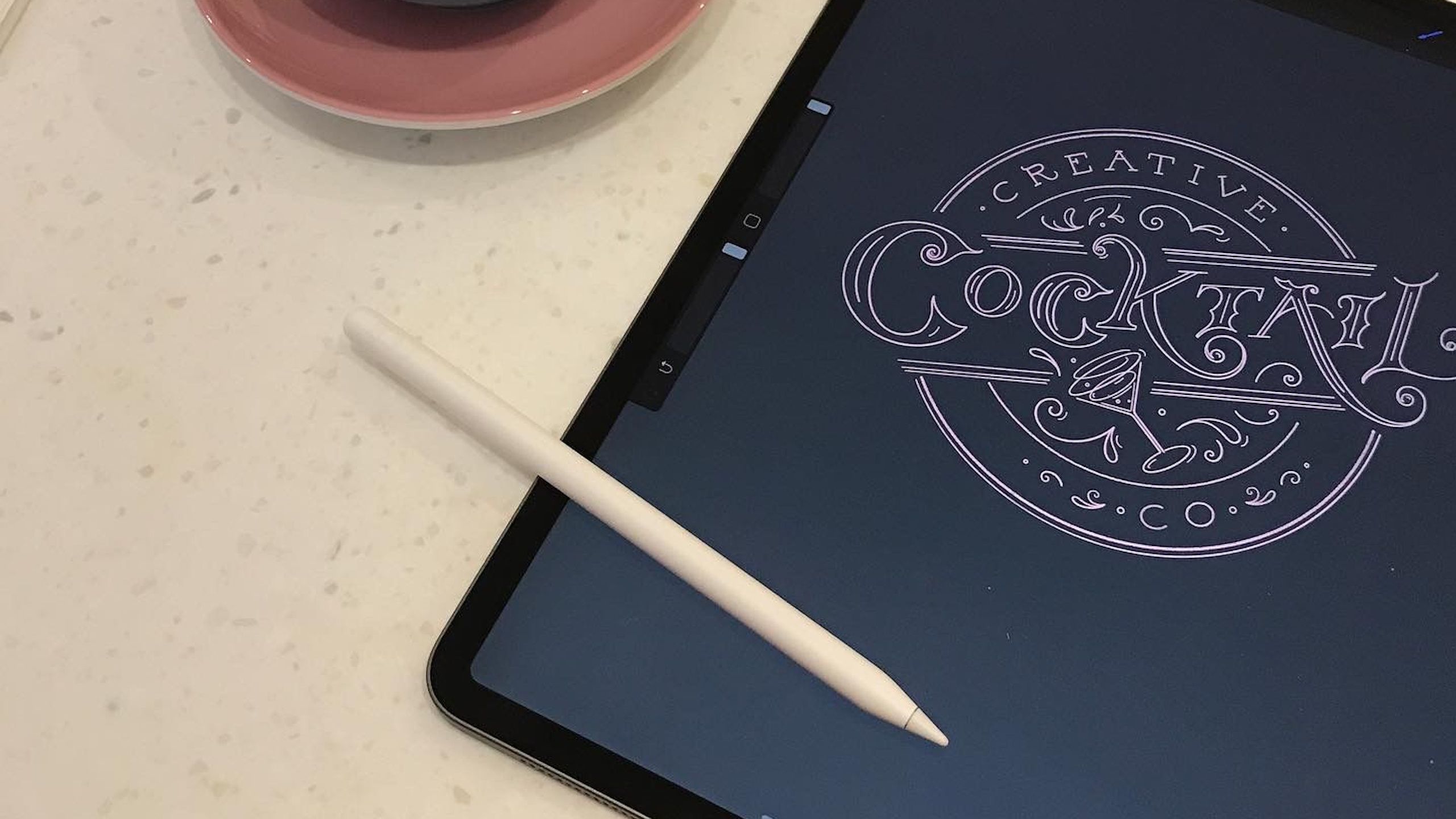 iPad on table with Apple Pencil on top and artwork on-screen