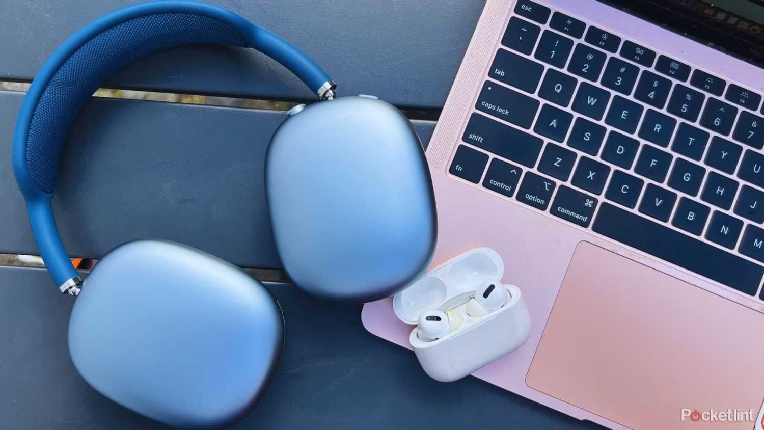 Airpods Max and Pro on a pink laptop