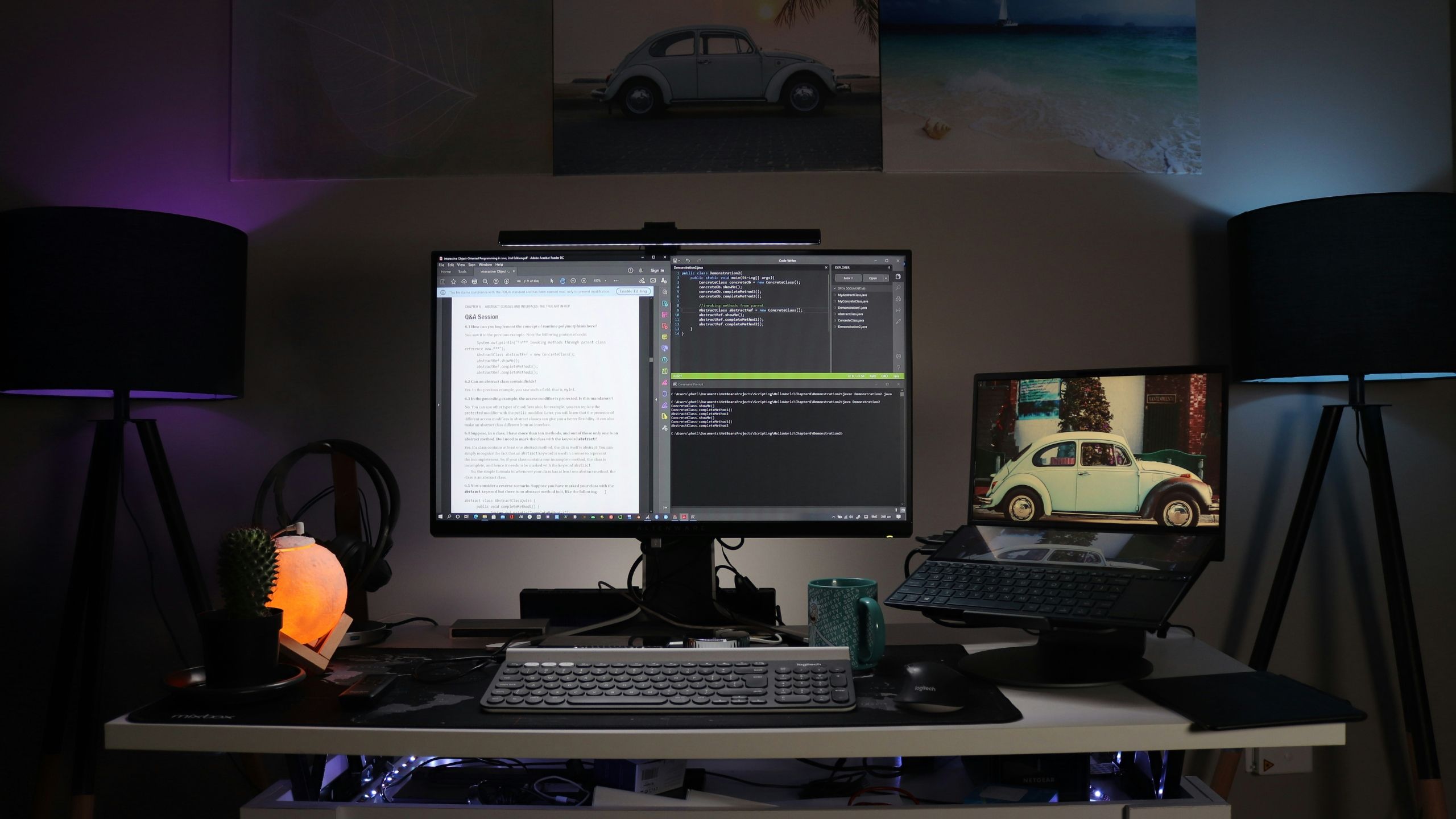 A dark desktop set up with a monitor with a split screen