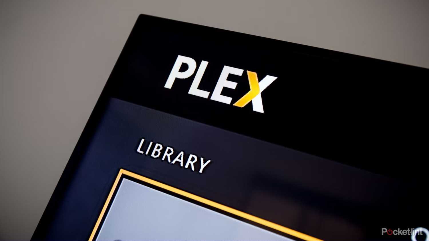 A close-up of the Plex logo on a display.
