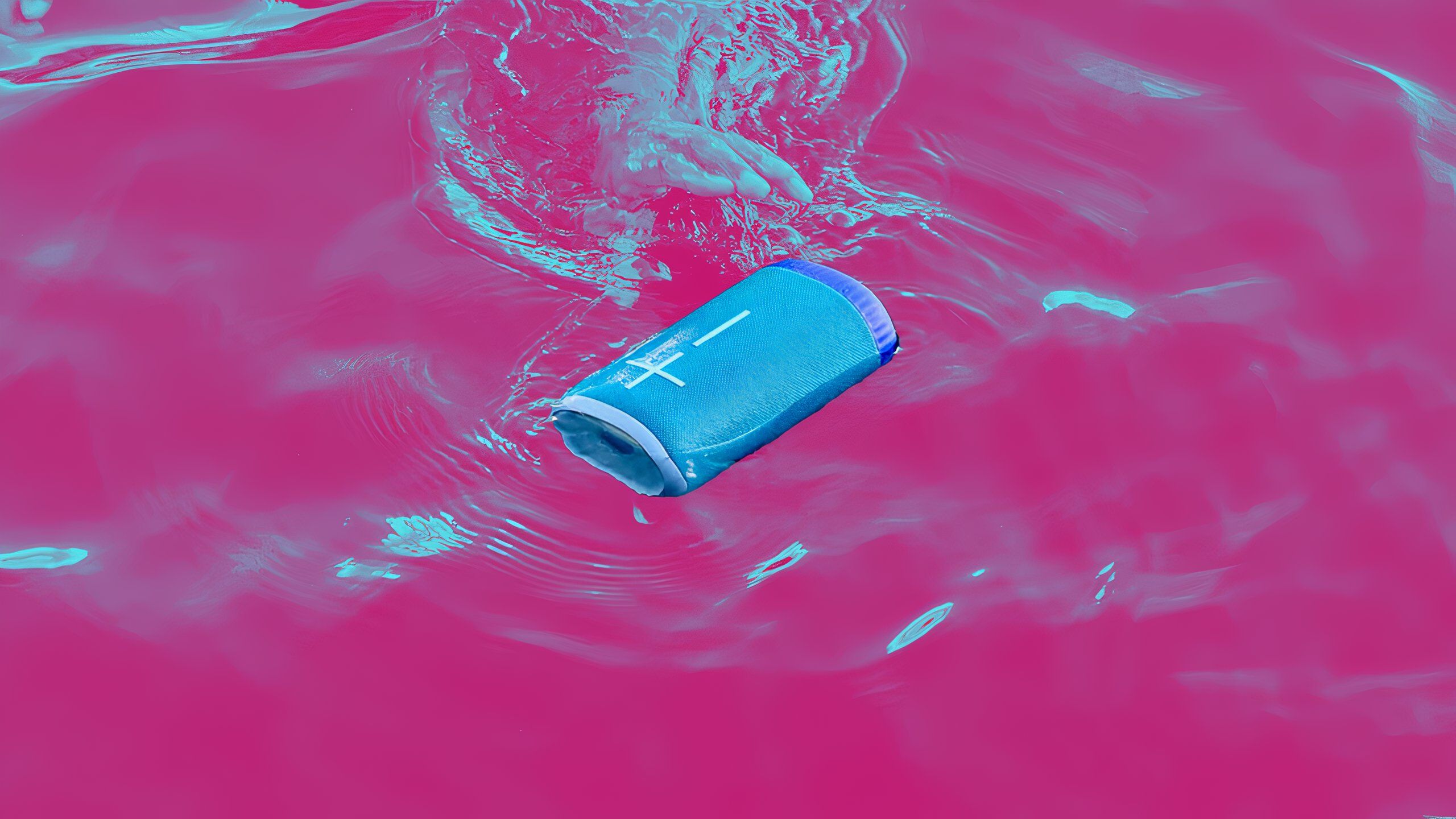 Ultimate Ears Everboom floating in water on a colored background