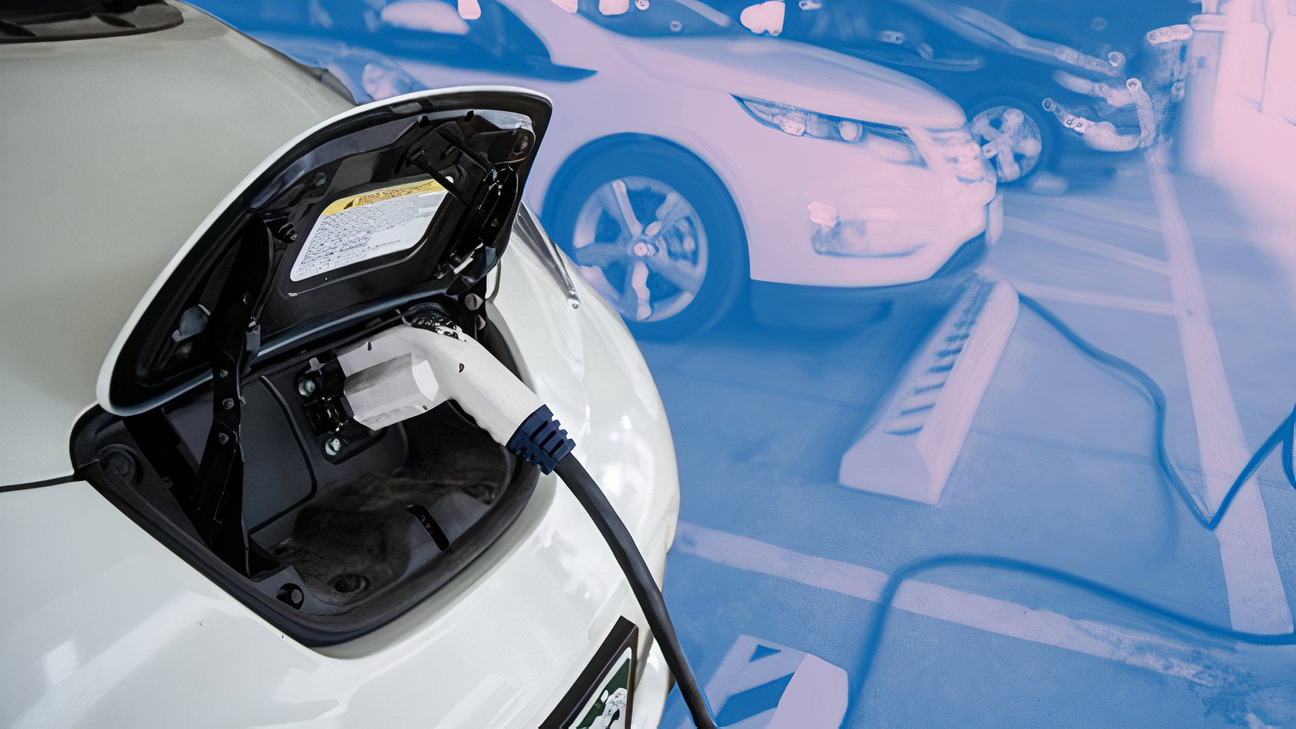 Charging an EV in a parking lot.