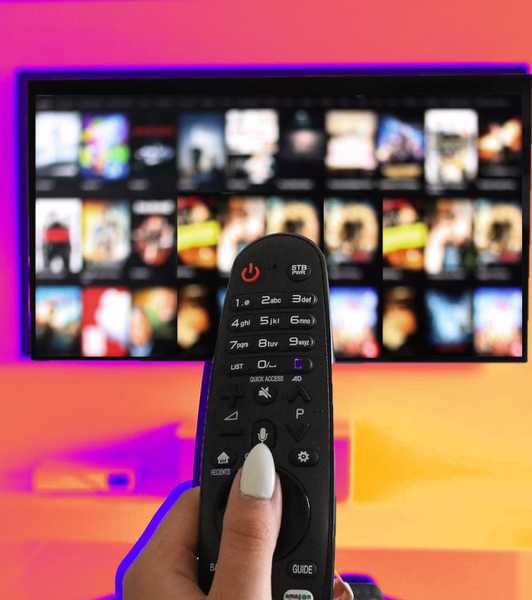 a multimedia remote controlling a streaming service on a colored background