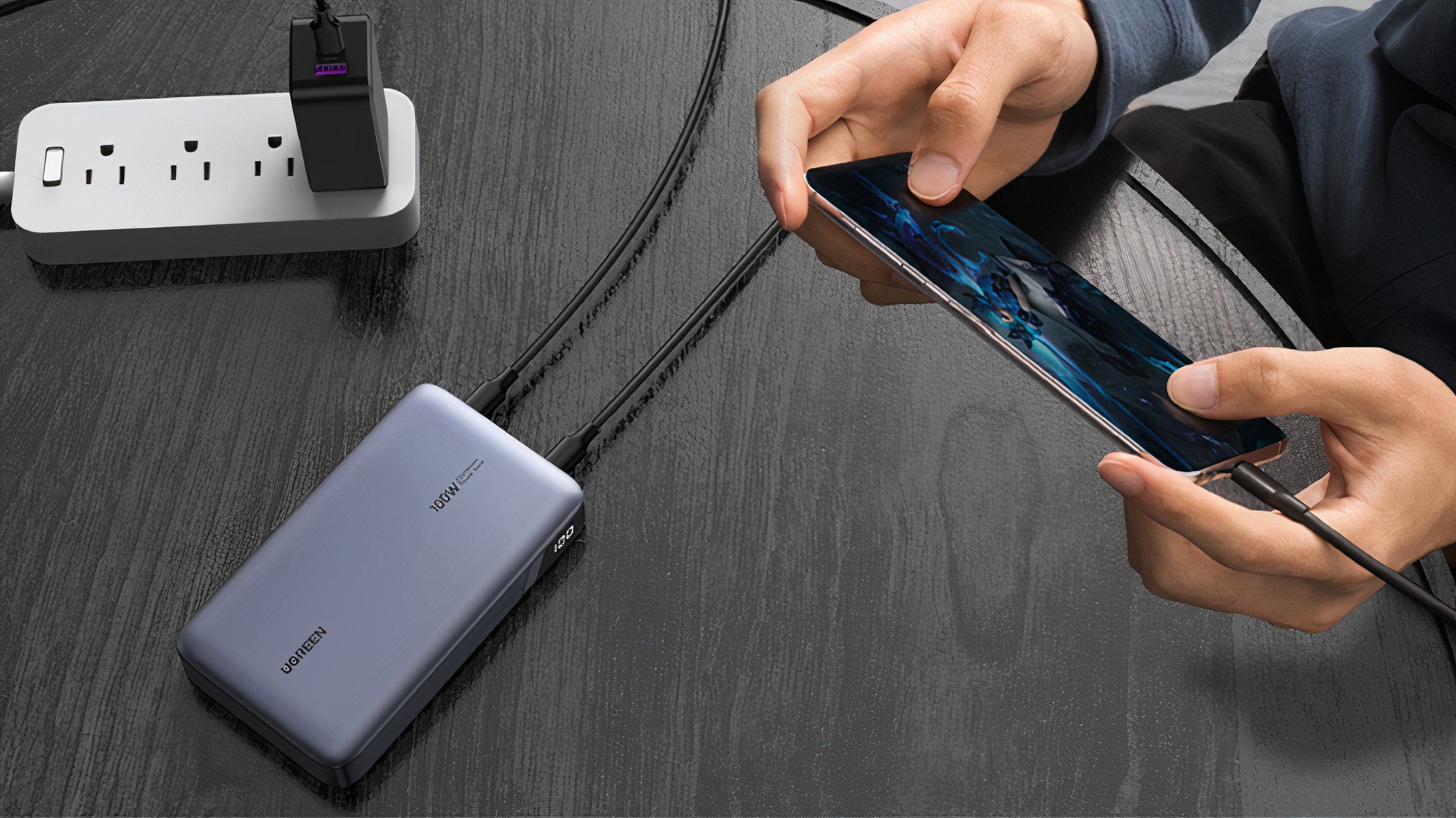 UGREEN 20,000mAh 100W Power Bank being used