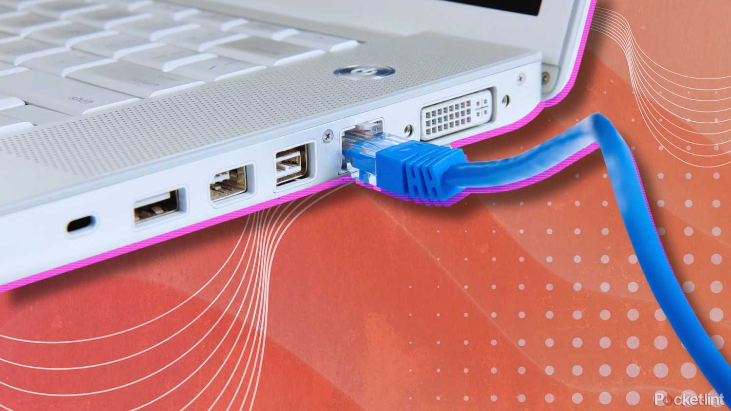 A laptop with an Ethernet cable plugged in.