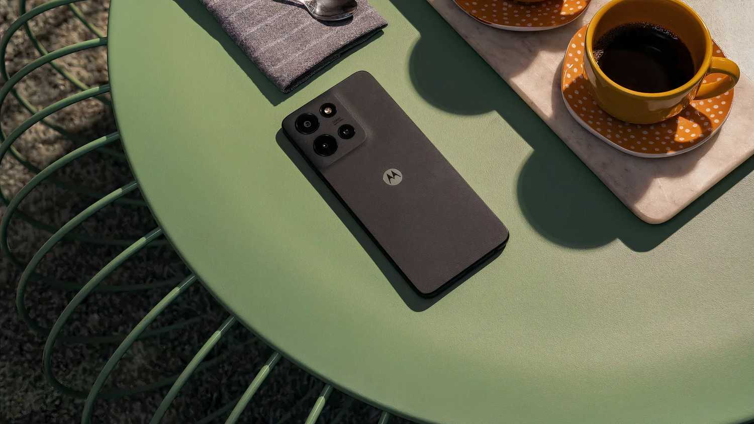 A coffee-colored Moto G Power on a table.