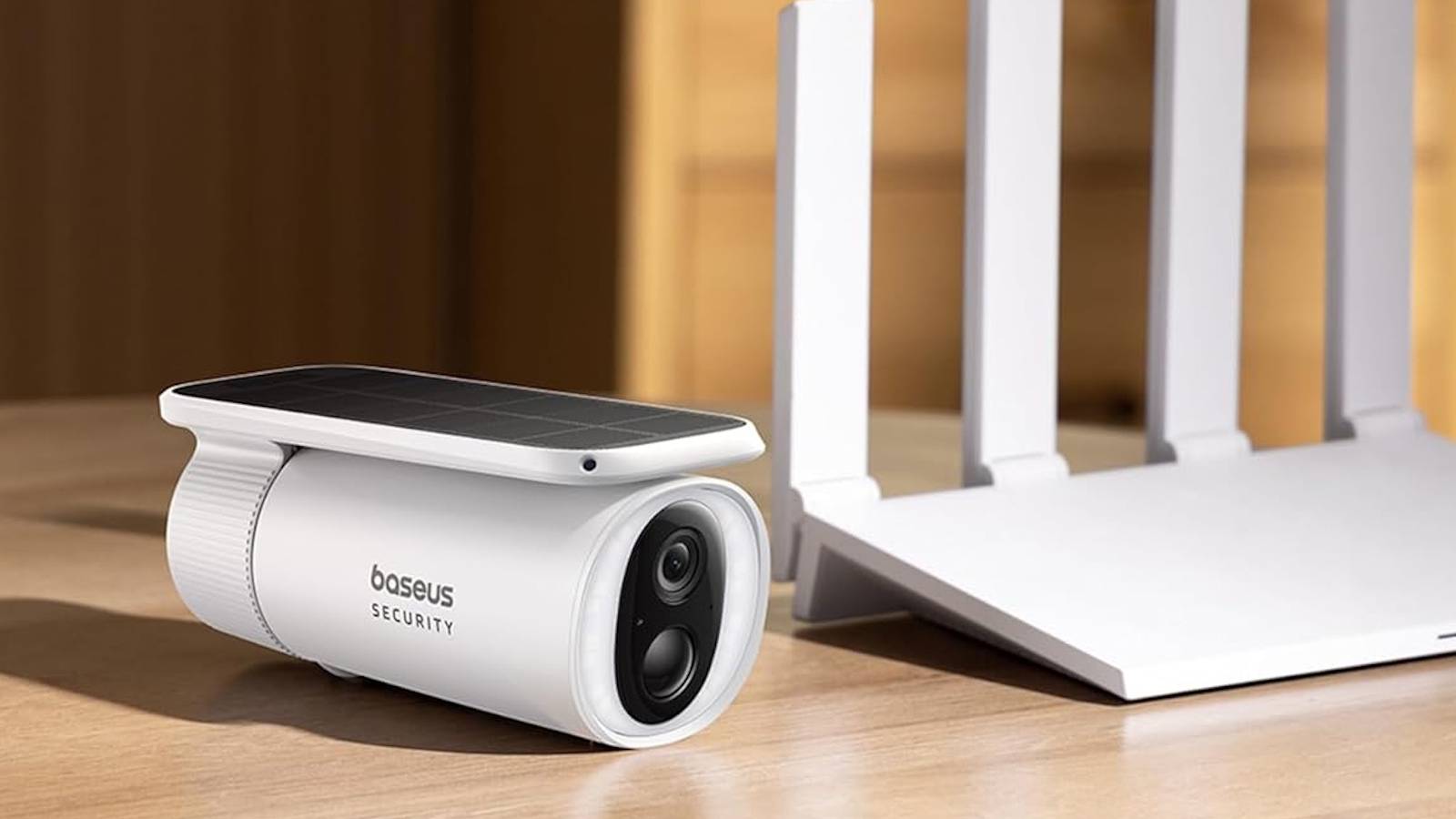 baseus outdoor security camera on desk next to router
