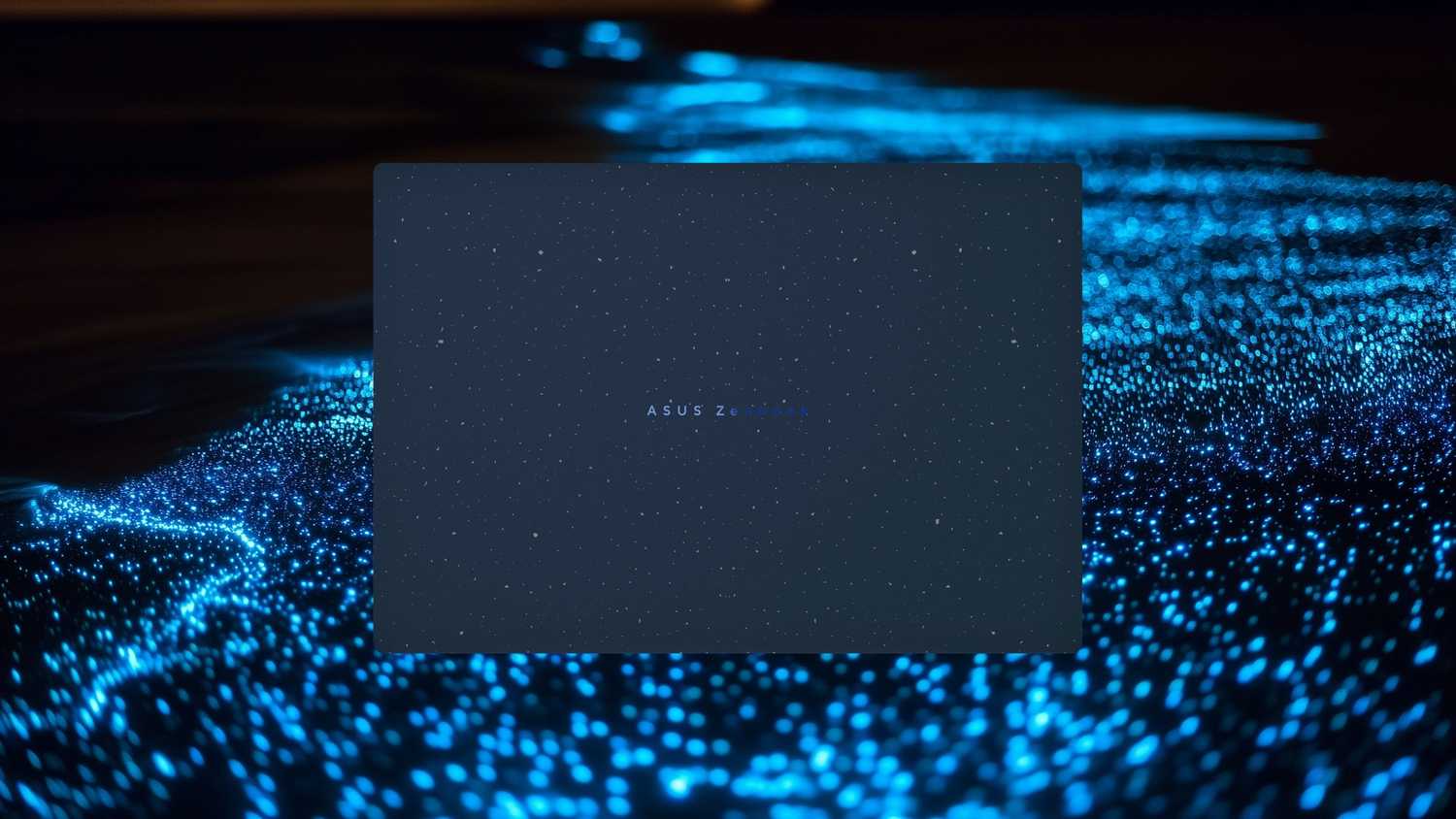 A Luminous Blue Zenbook in front of bioluminescent plankton. 