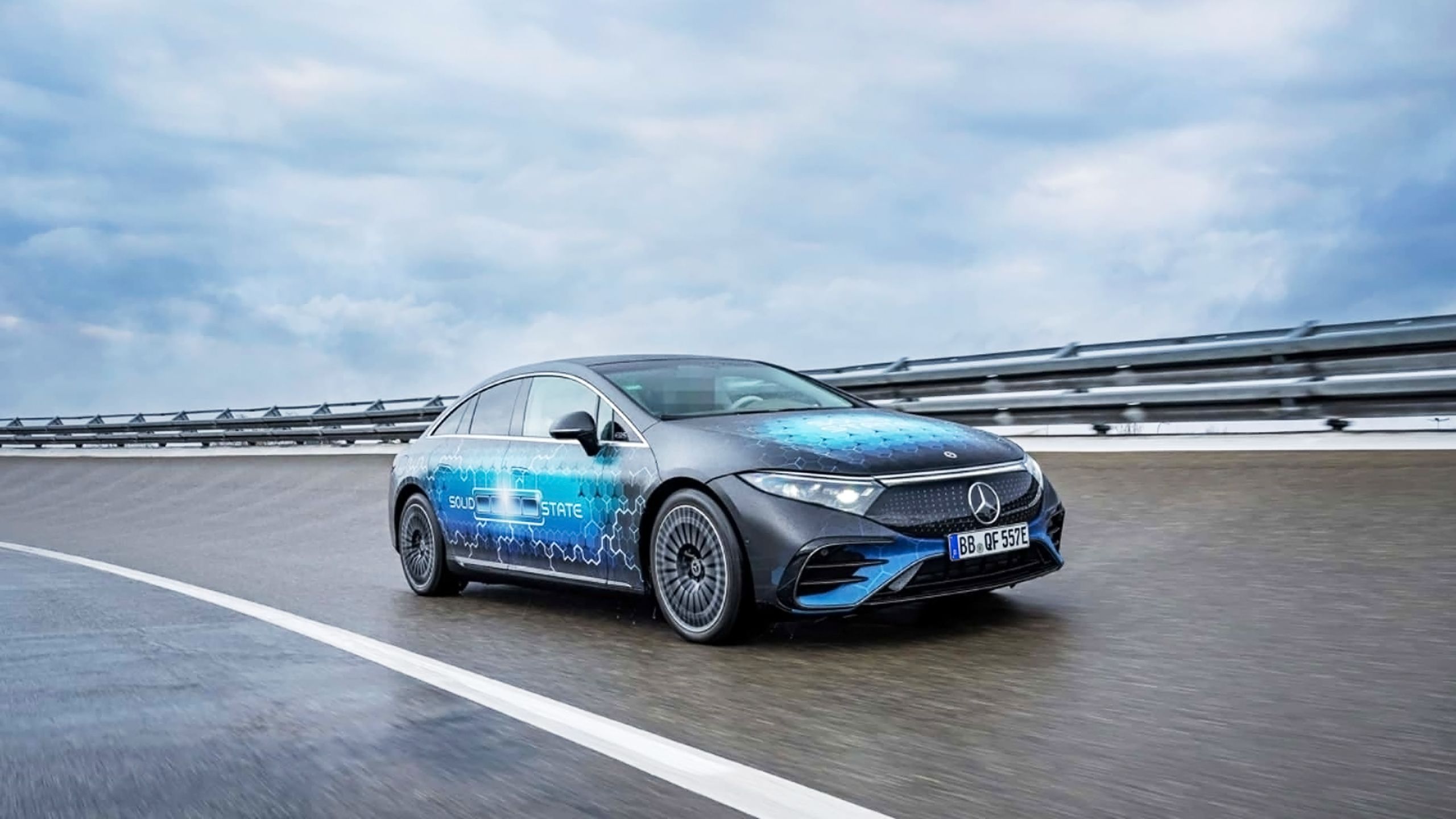 A Mercedes-Benz prototype car with a solid-state battery, driving on a test track.