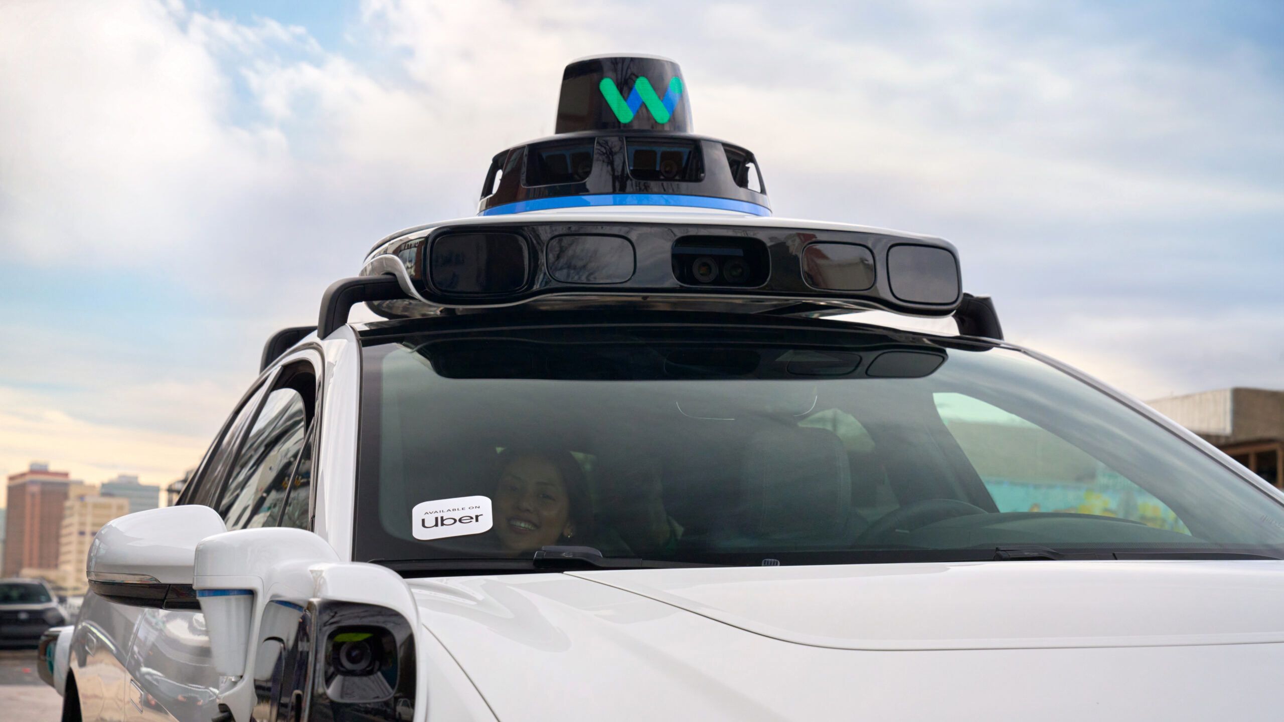 A Waymo Uber with a passenger.