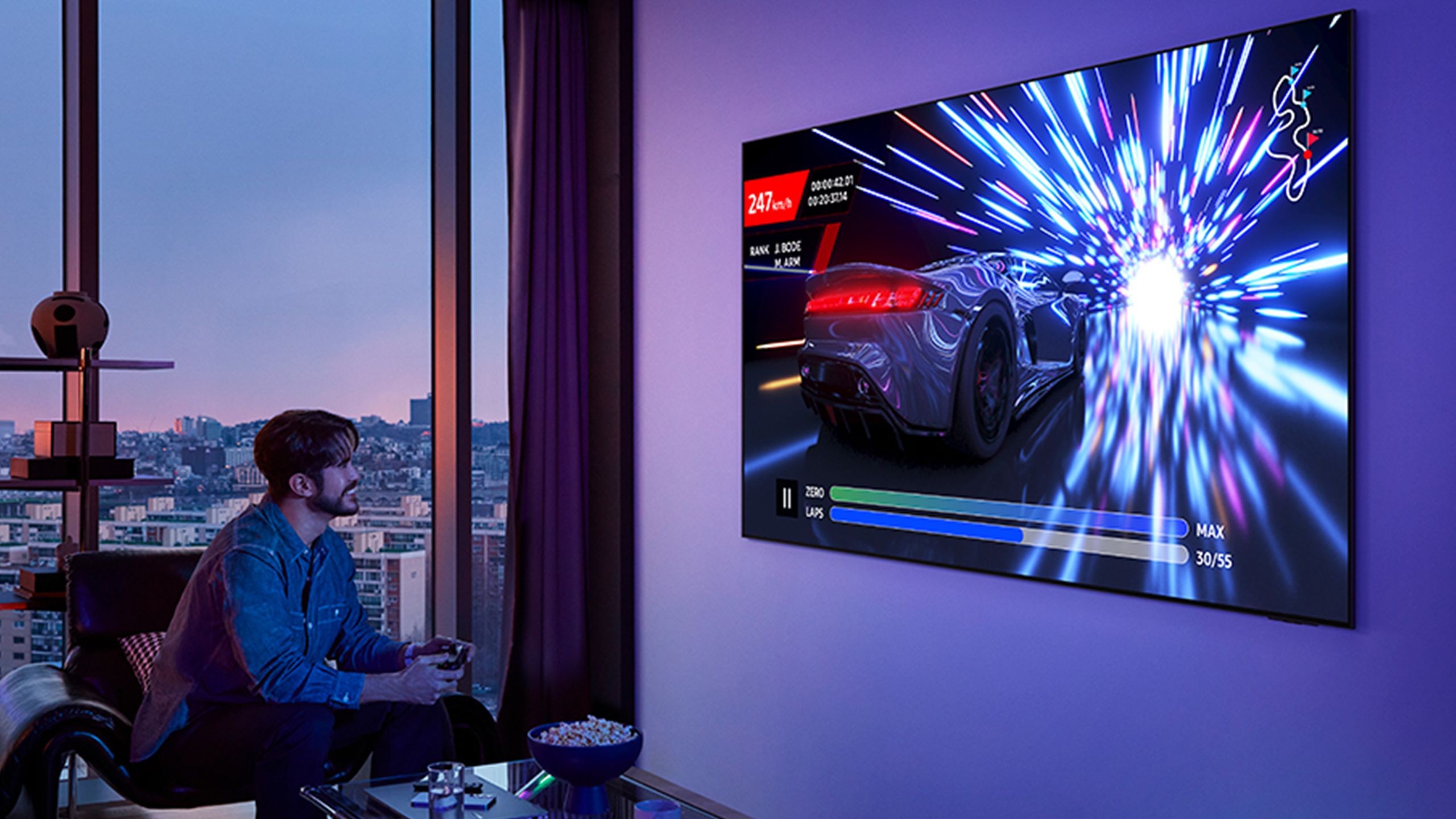 Person playing games on Samsung OLED TV.