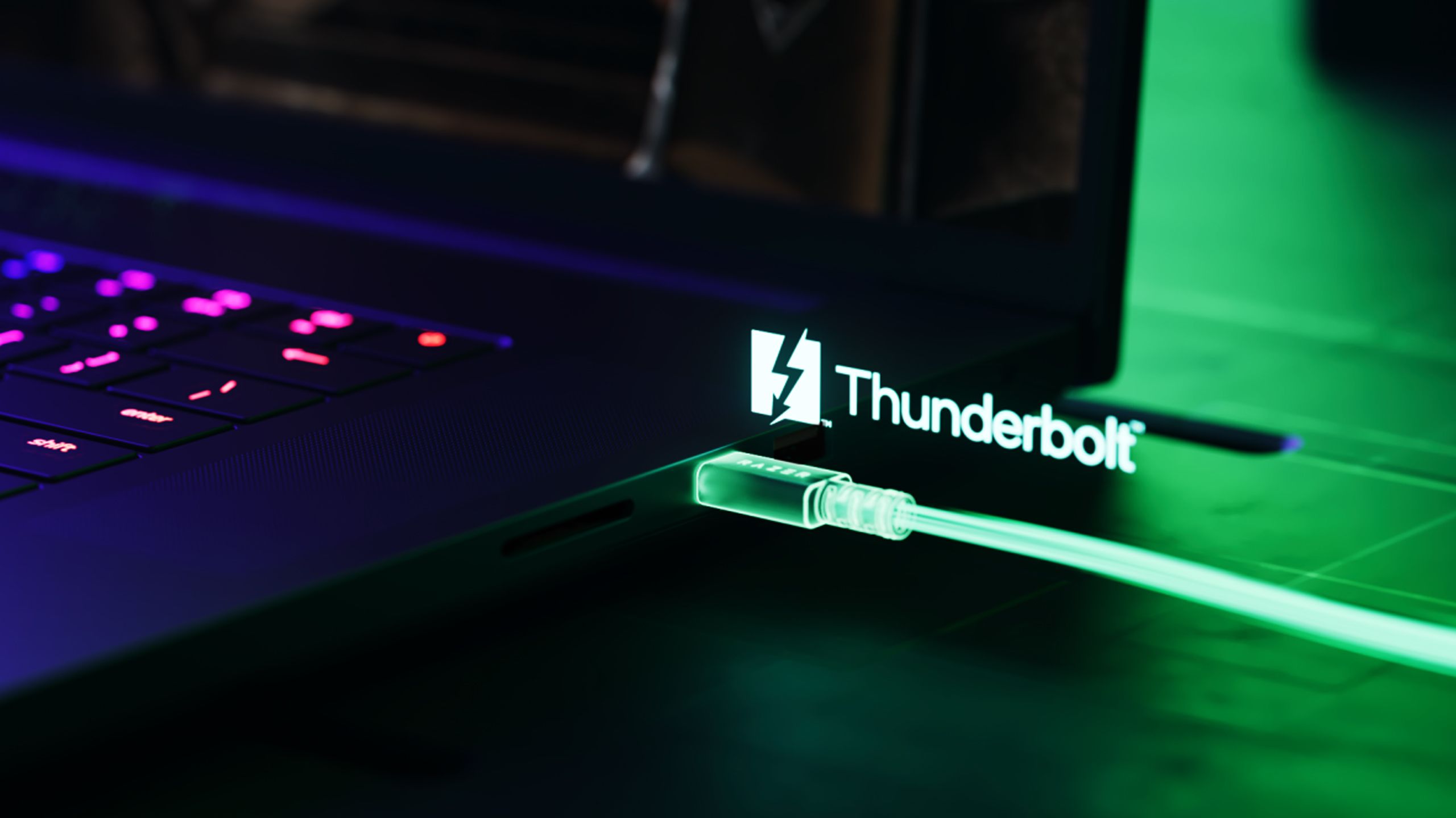 A Razer laptop with a Thunderbolt 5 cable attached.