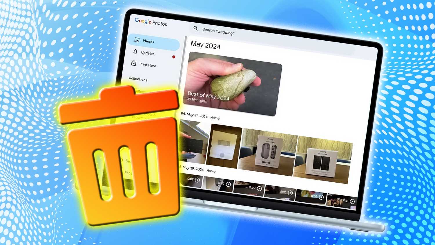 A MacBook with a trash can in front of it. 