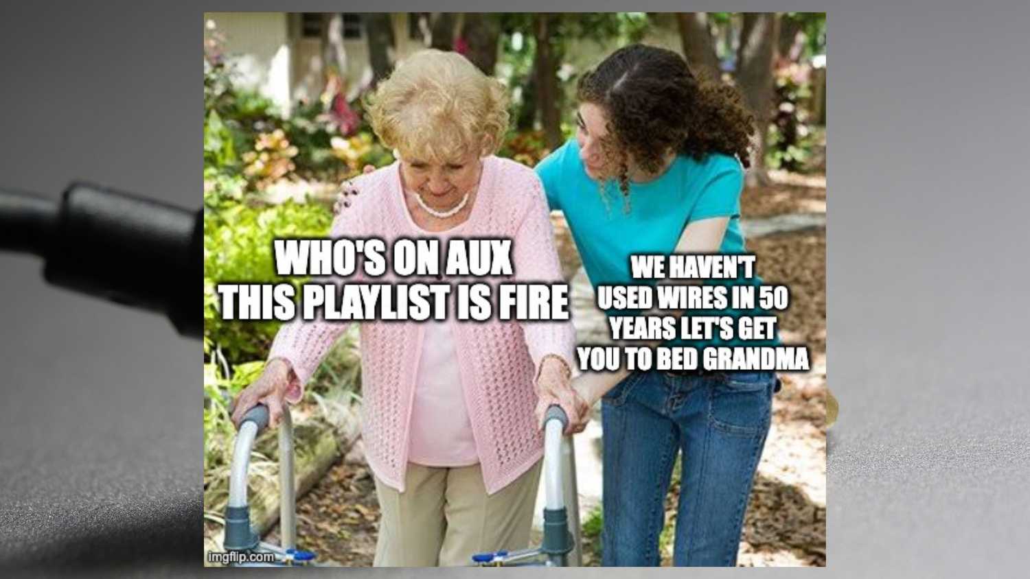 A grandmother being pushed by her granddaughter.