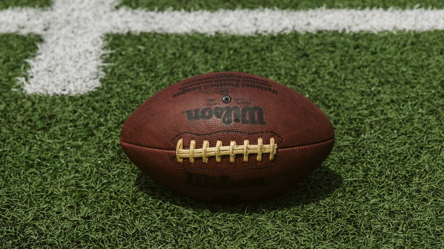 A football on turf. 