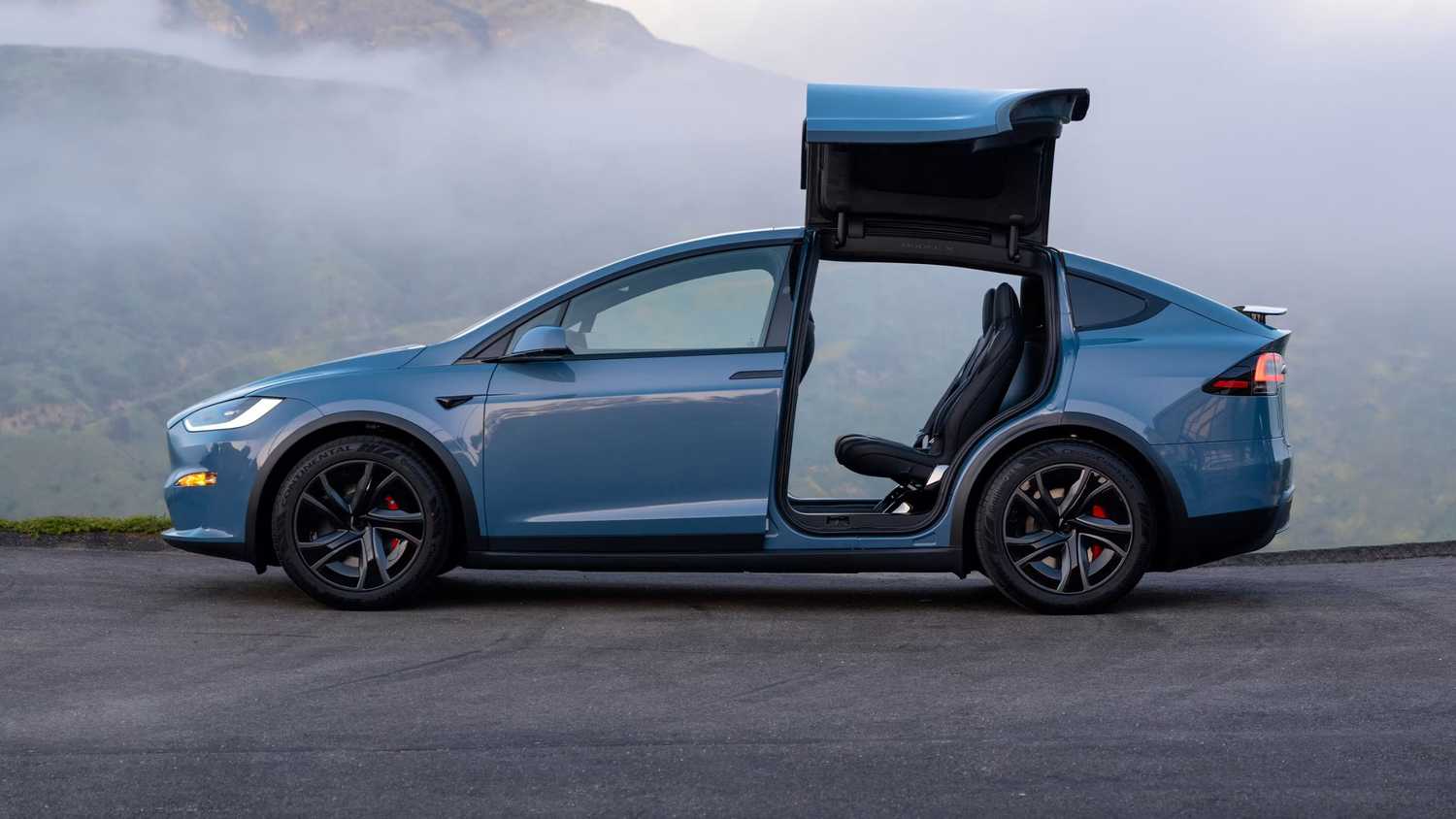Model X tesla with falcon doors open. 