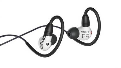 White wired in-ear headphones coiled around each other.