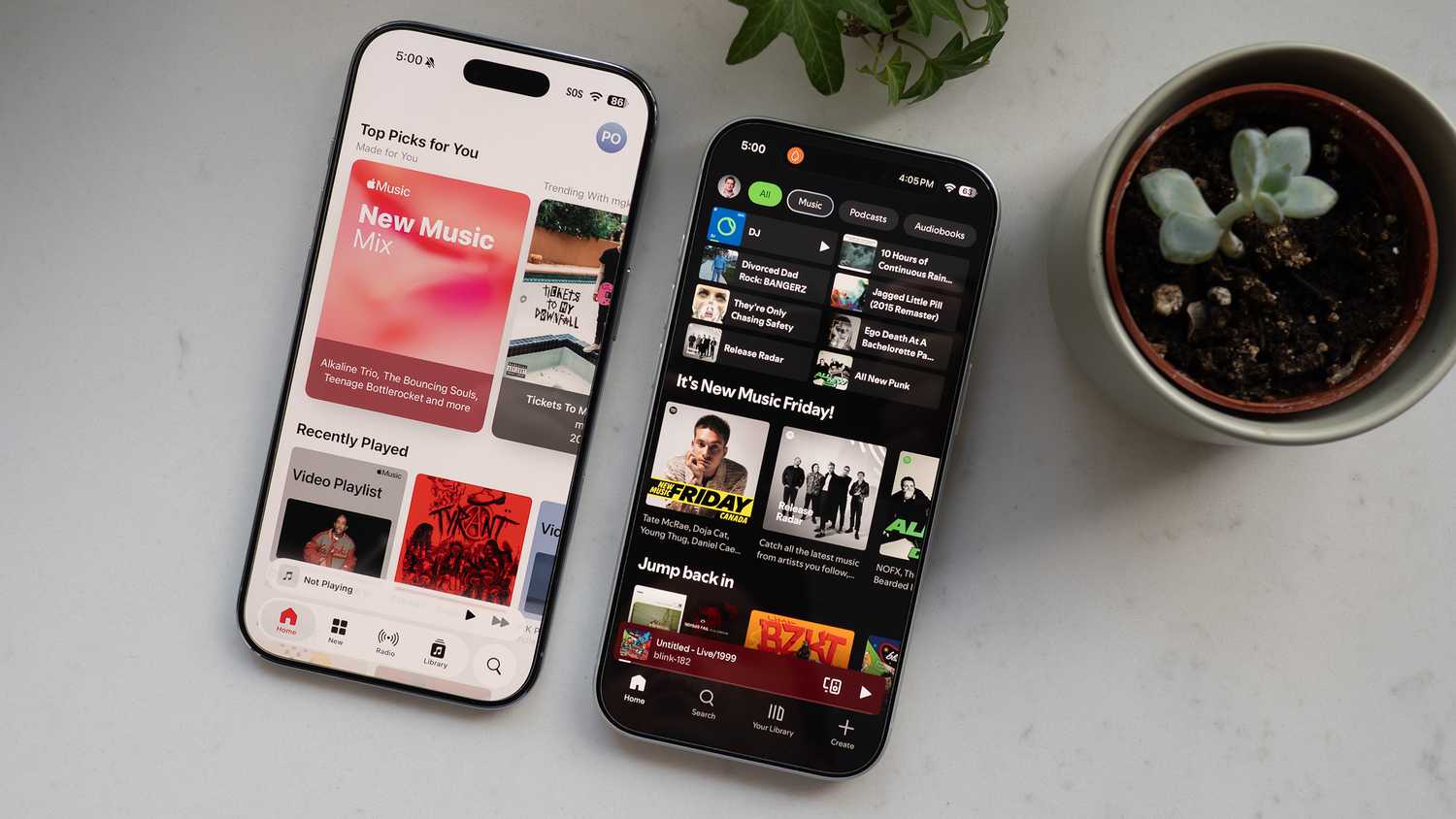 Apple Music and Spotify open on iPhones
