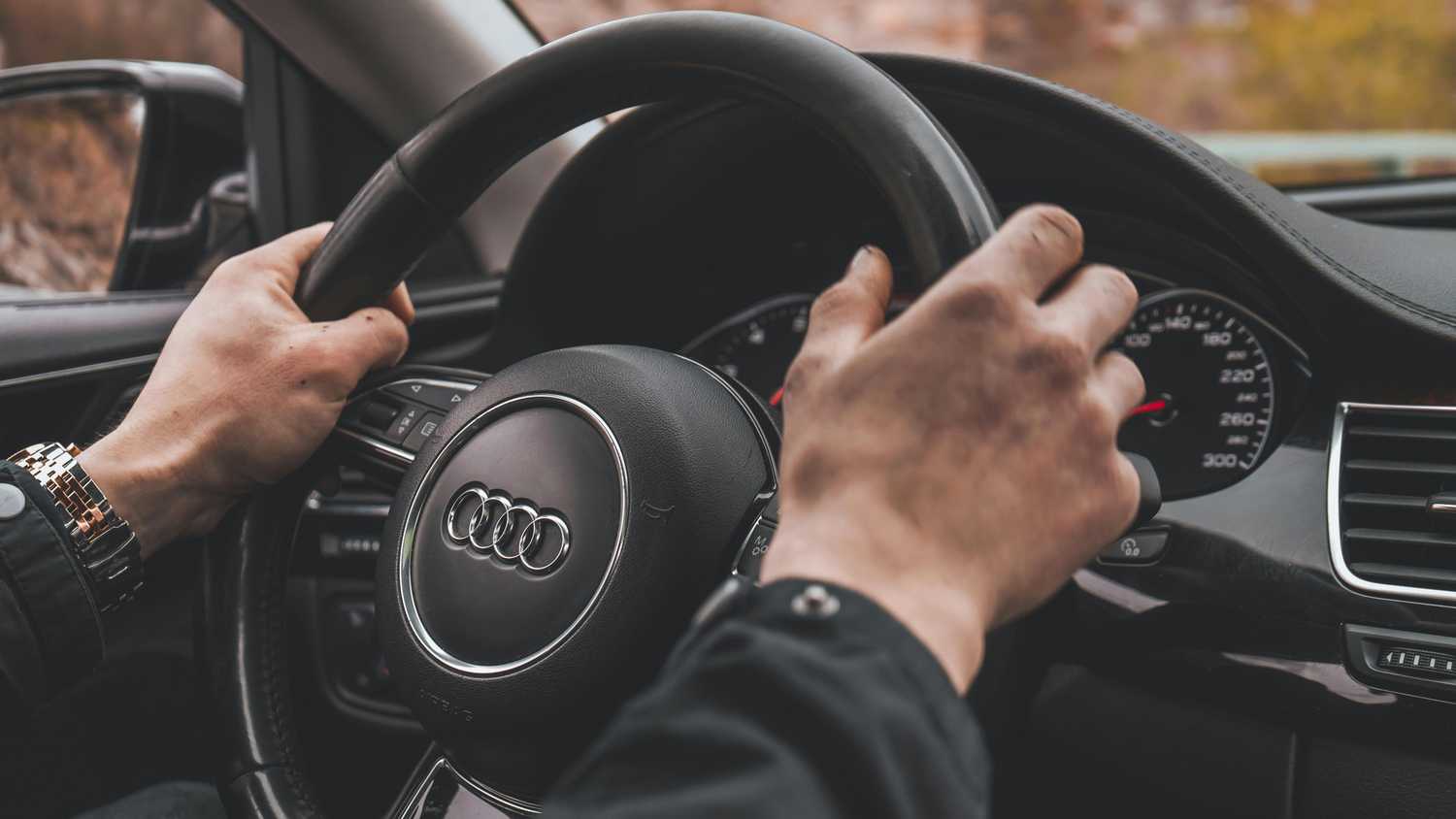 Hands holding steering wheel in the 10/2 o'clock position