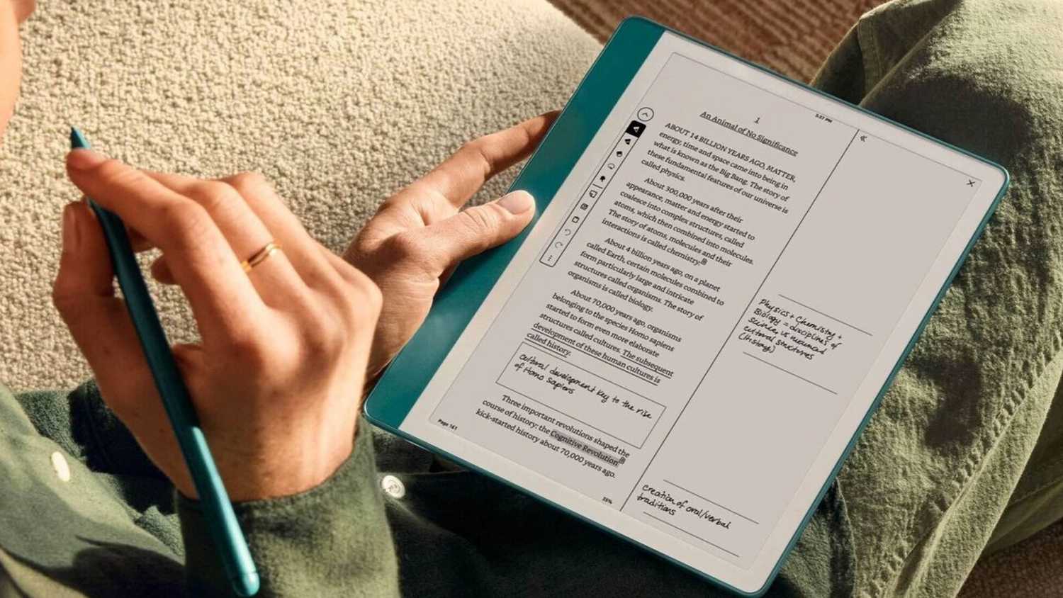 Person taking notes on Kindle Scribe.