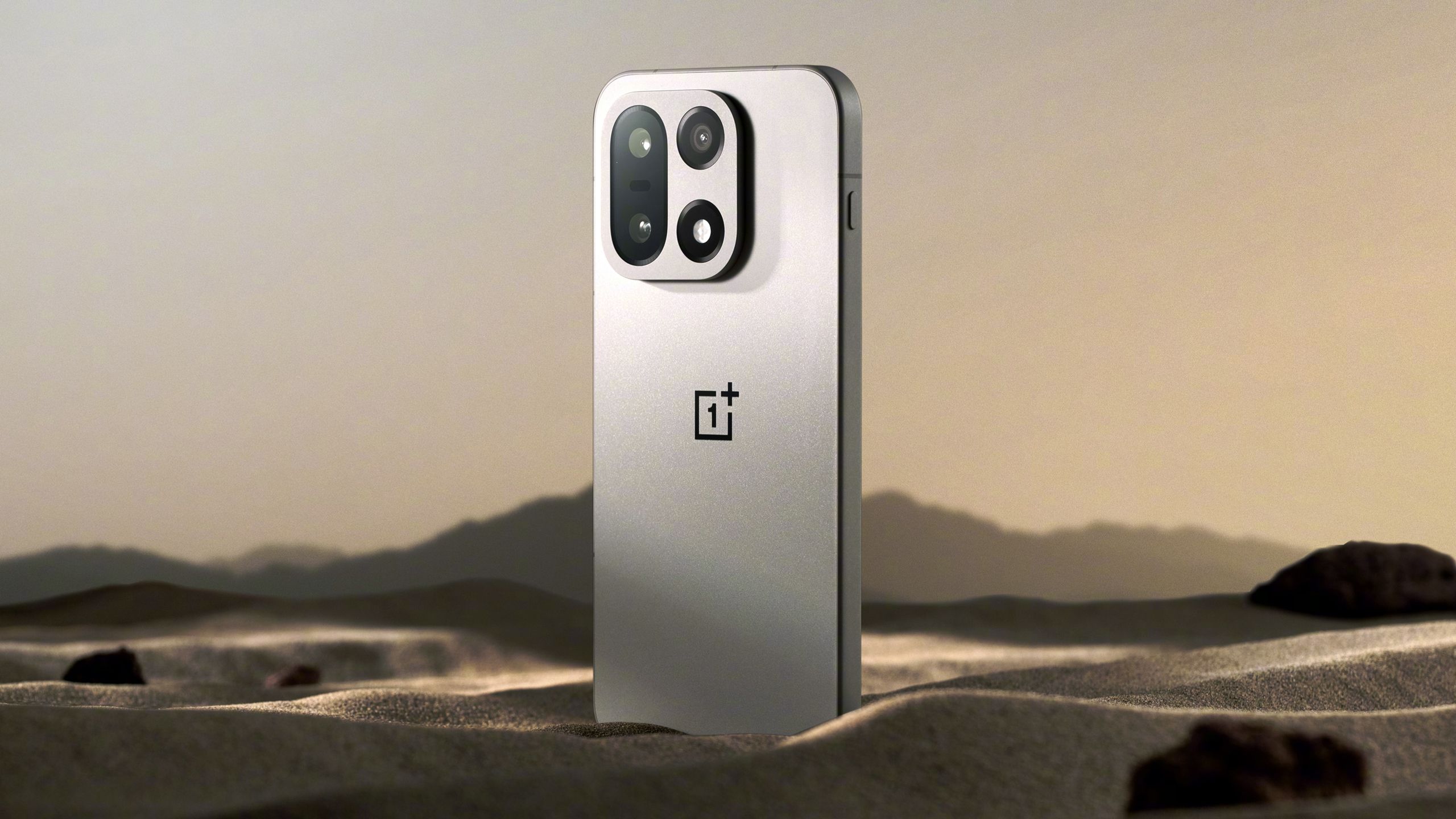 OnePlus 15 in sand.