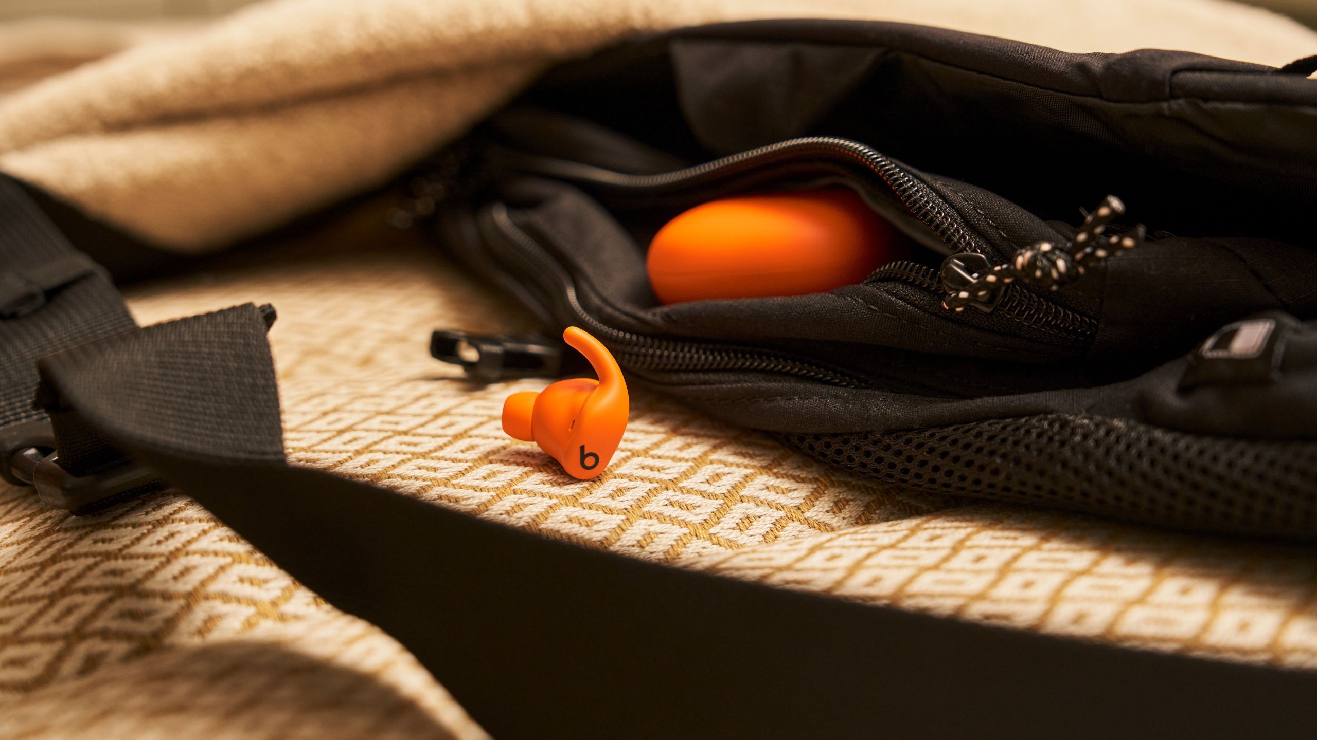 Orange Powerbeats Fit. 