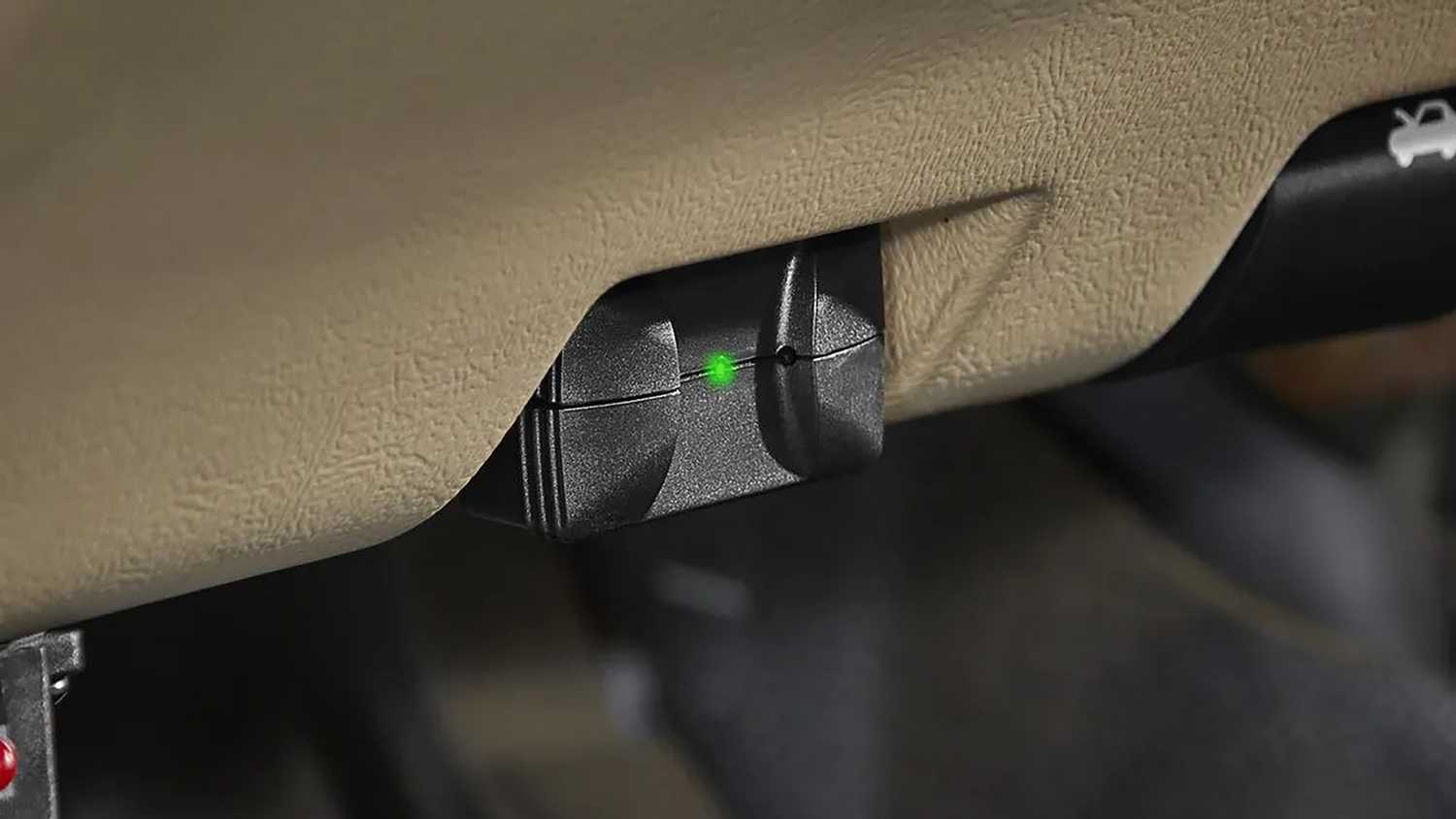 A still photo of the ZR-BT1 OBD2 scanner plugged into a port. 