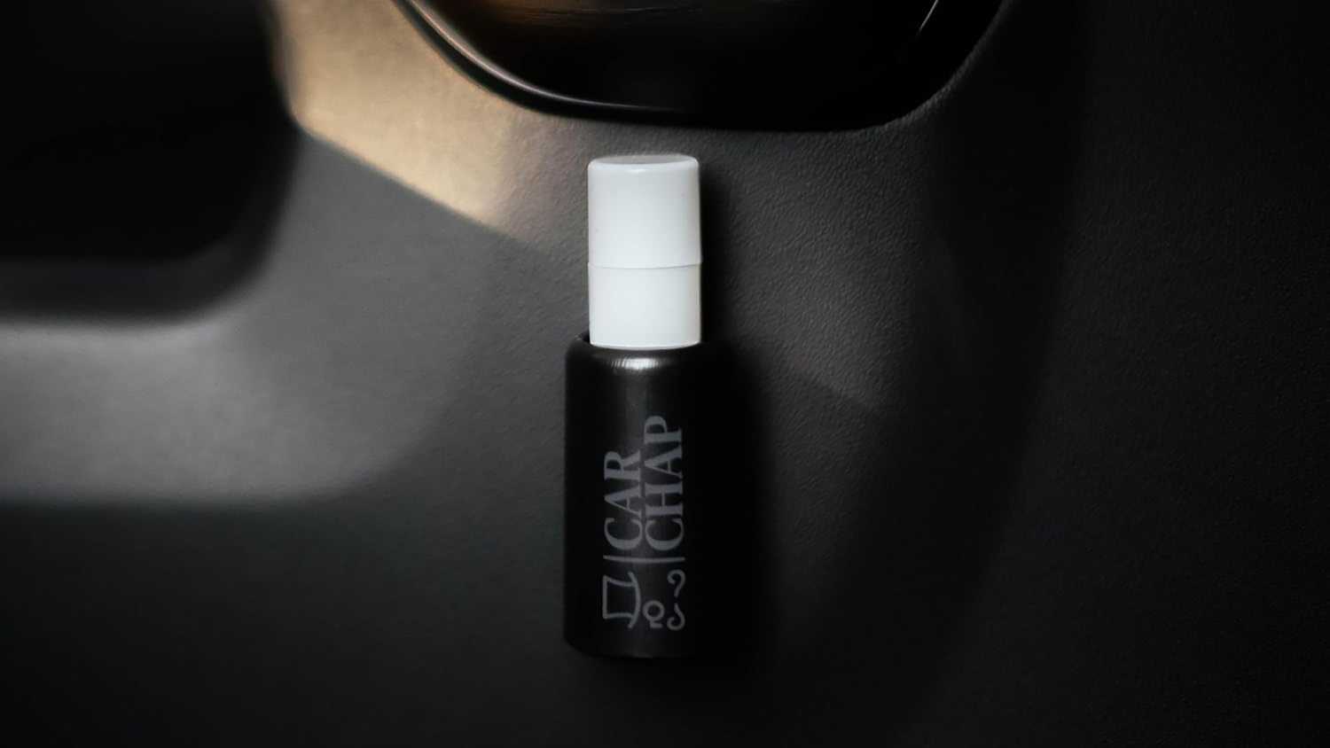 A still photo of the Car Chap chapstick holder. 