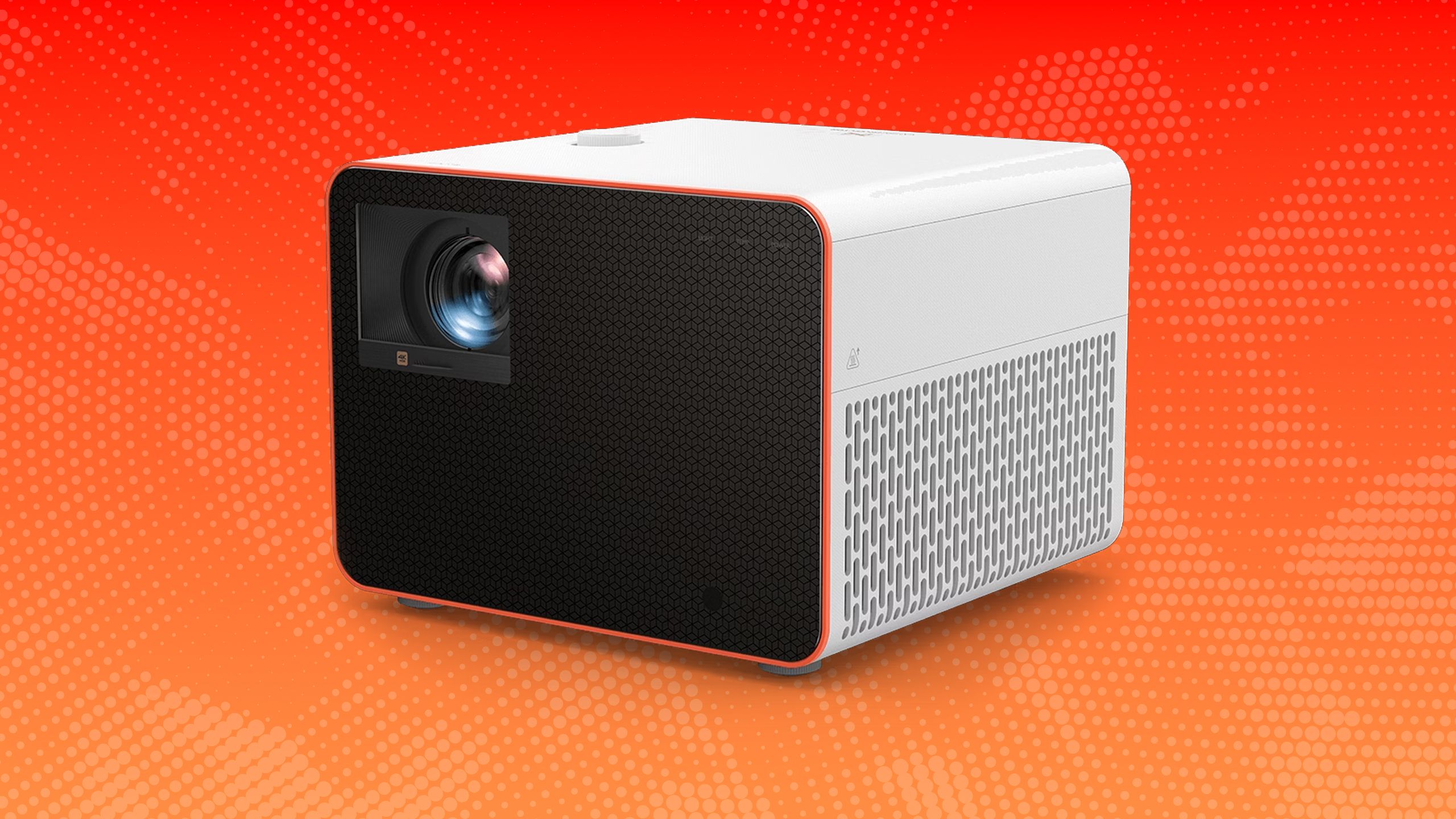 A projector on an orange background. 