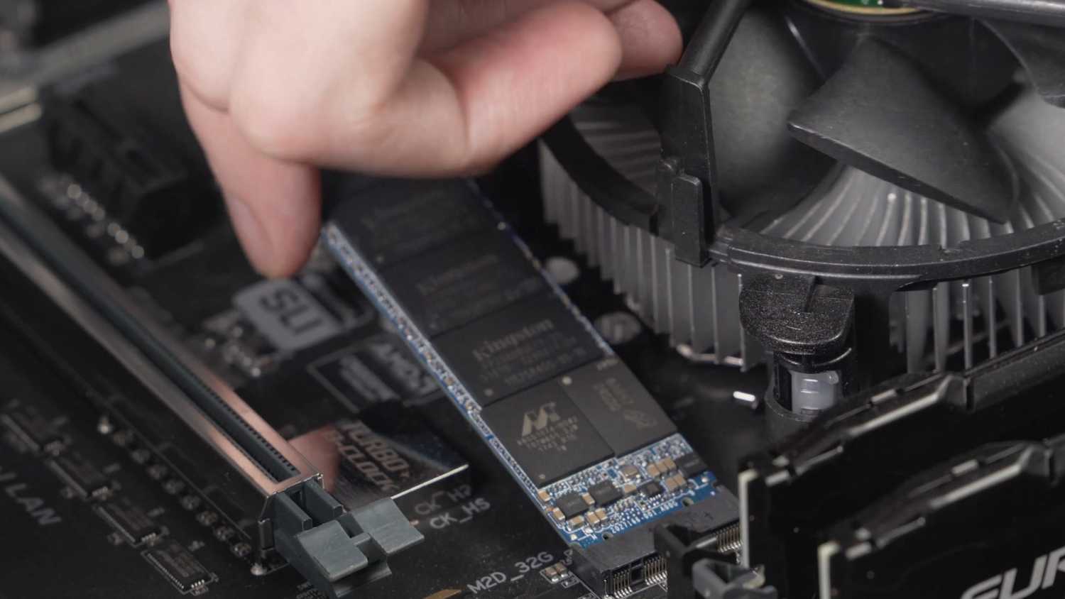 Person installing Kingston SSD.