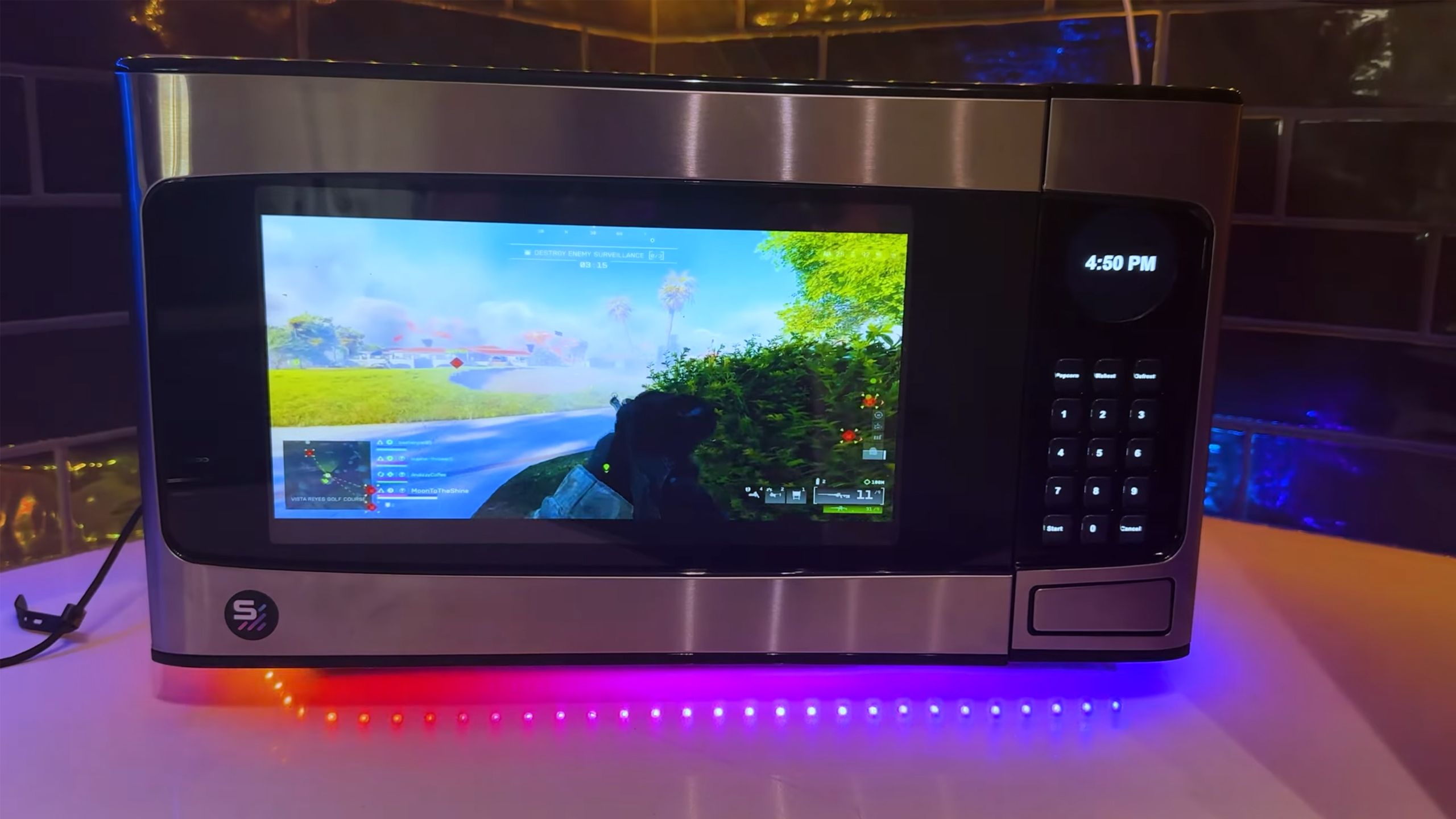 Microwave turned into a PC playing Battlefield 6.