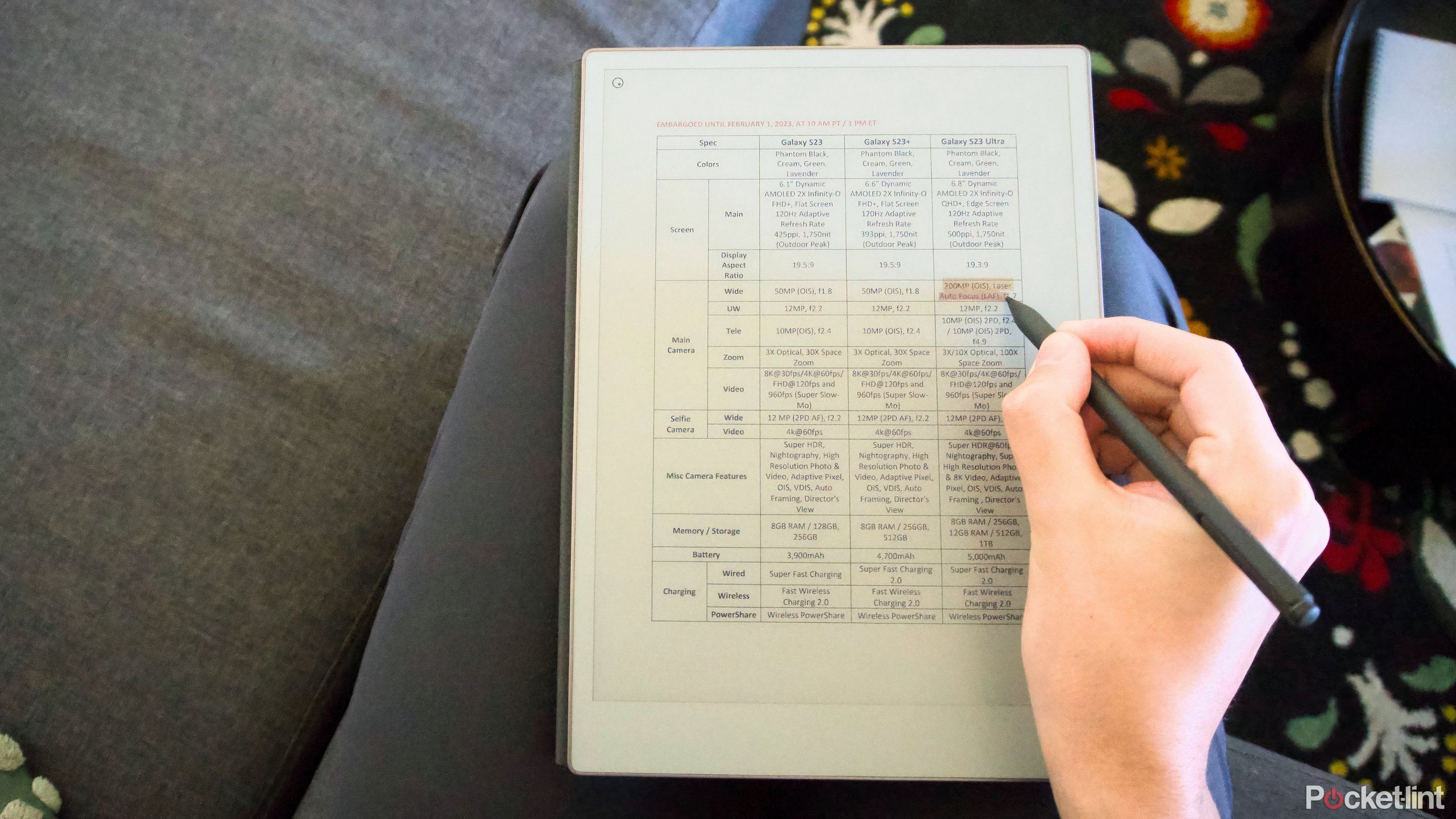 A hand highlighting a PDF on a reMarkable Paper Pro.