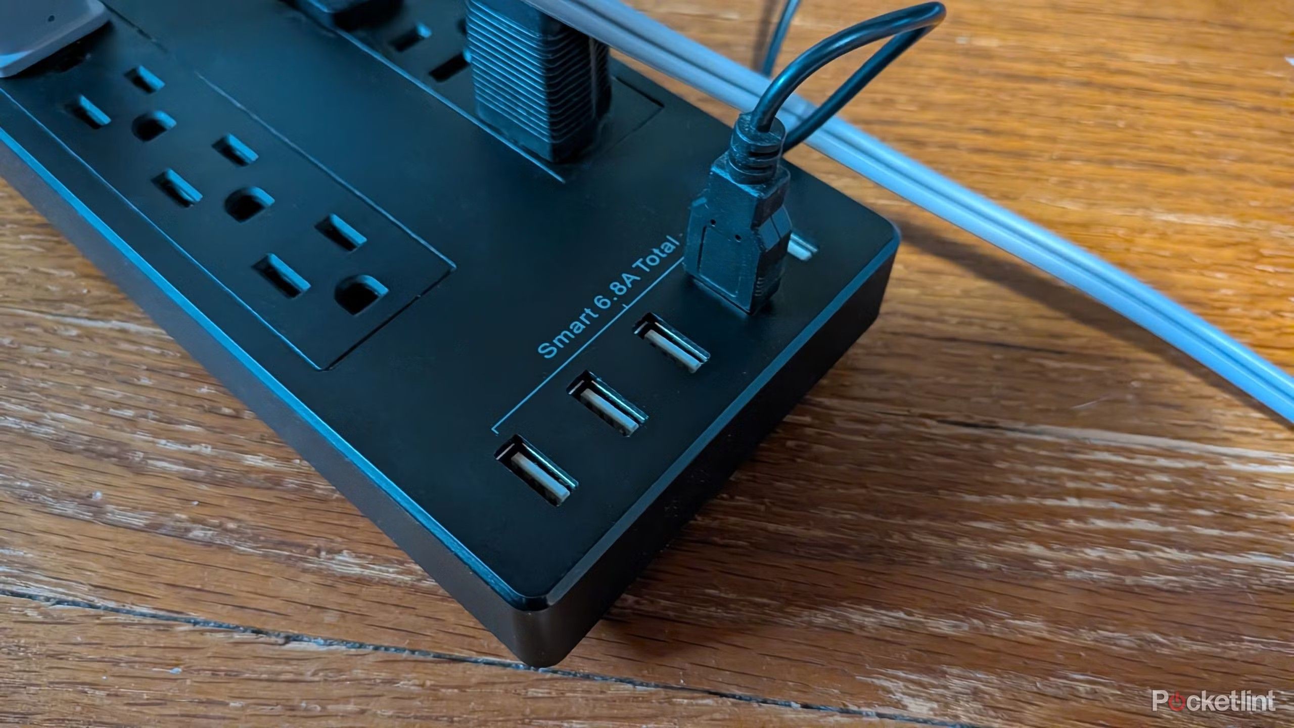 A photo of a power strip with four USB ports.