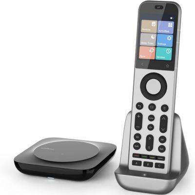 A SofaBaton X2 remote next to transmitter.