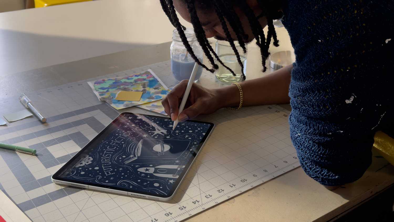 Someone drawing on an iPad with an Apple Pencil in the Pixelmator Pro app.