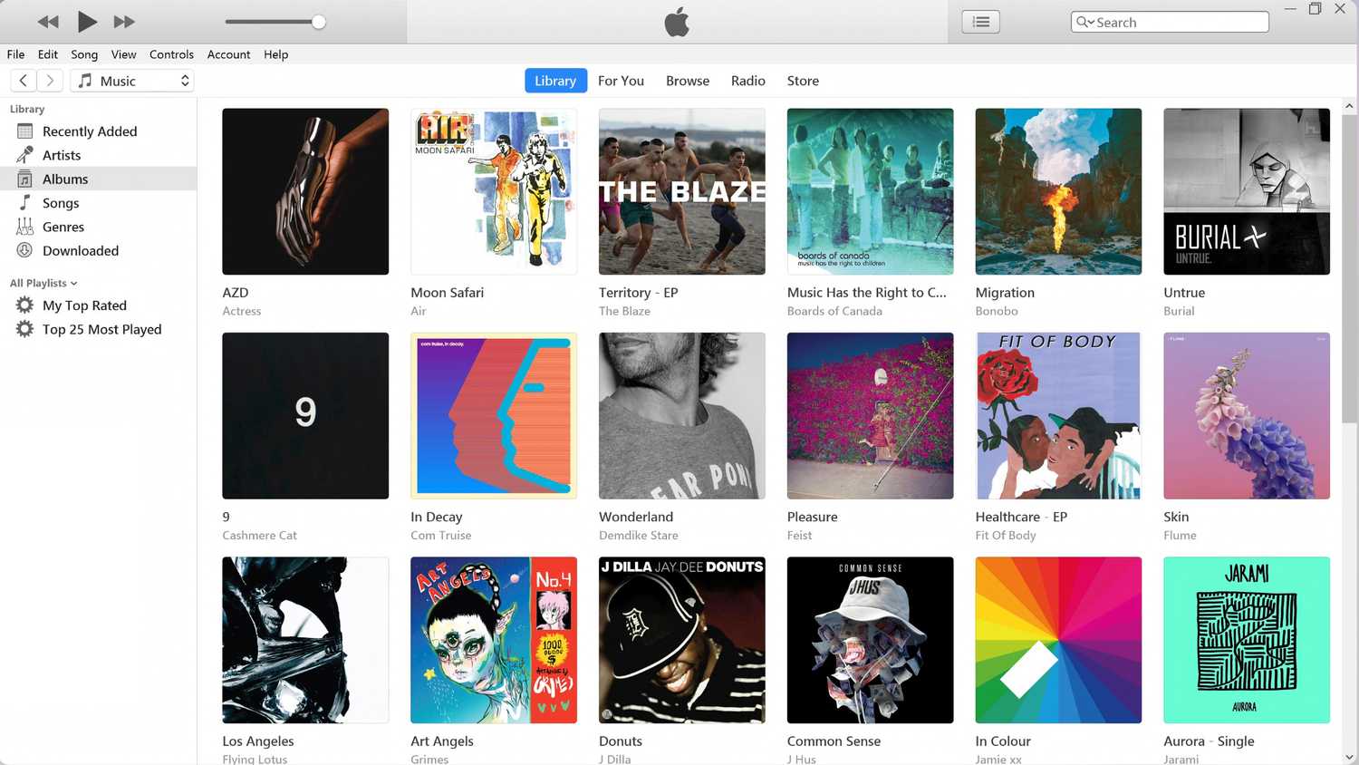 iTunes for Windows displaying a library of music albums.