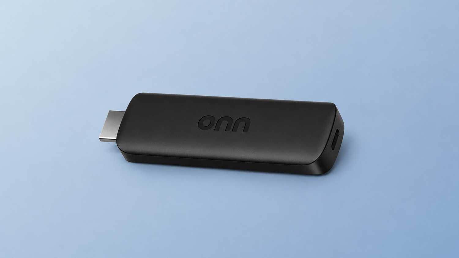 Onn HD streaming stick on light blue background.