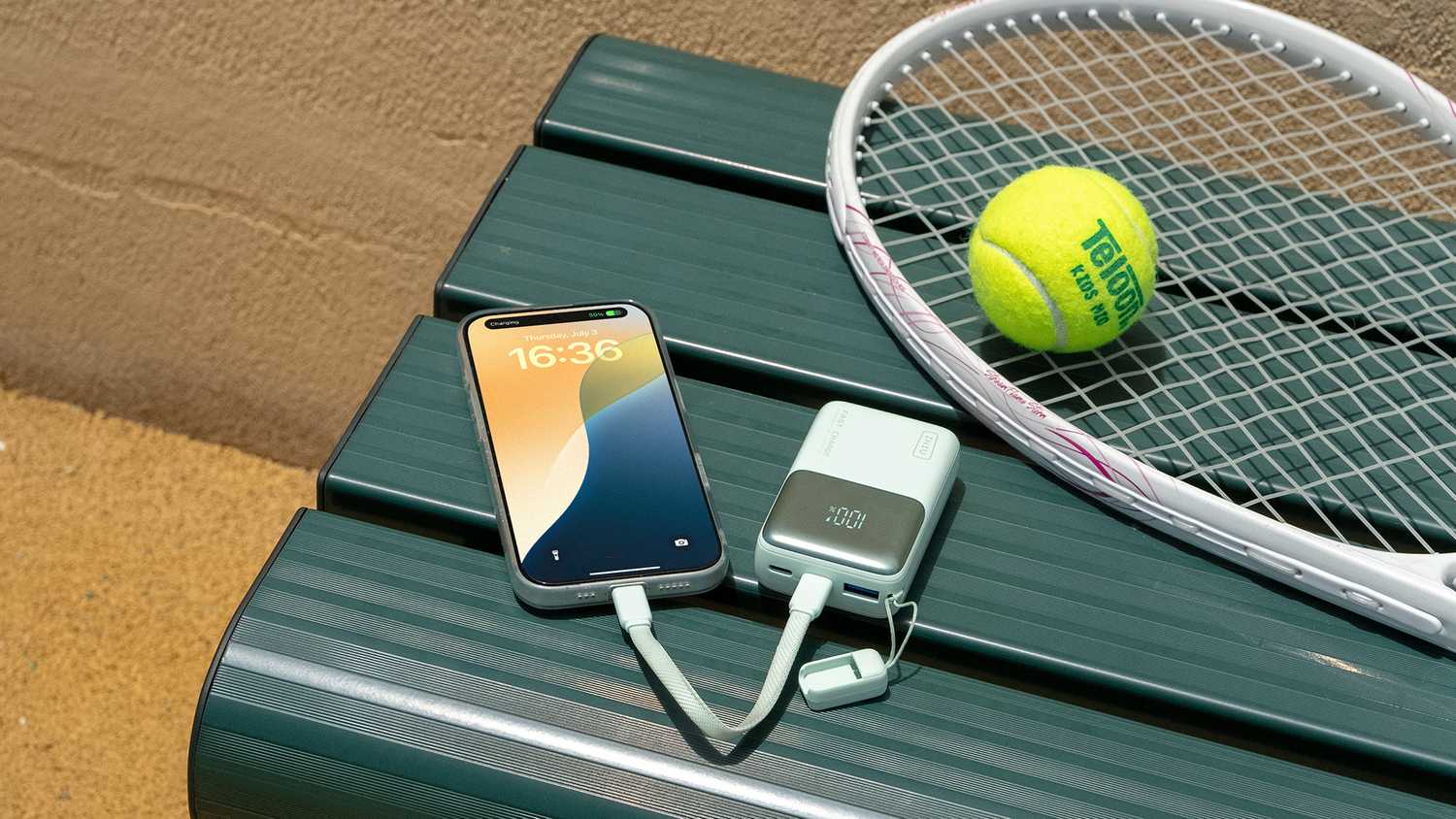 The INIU Pocket Rocket P50 portable charger plugged into a smartphone.
