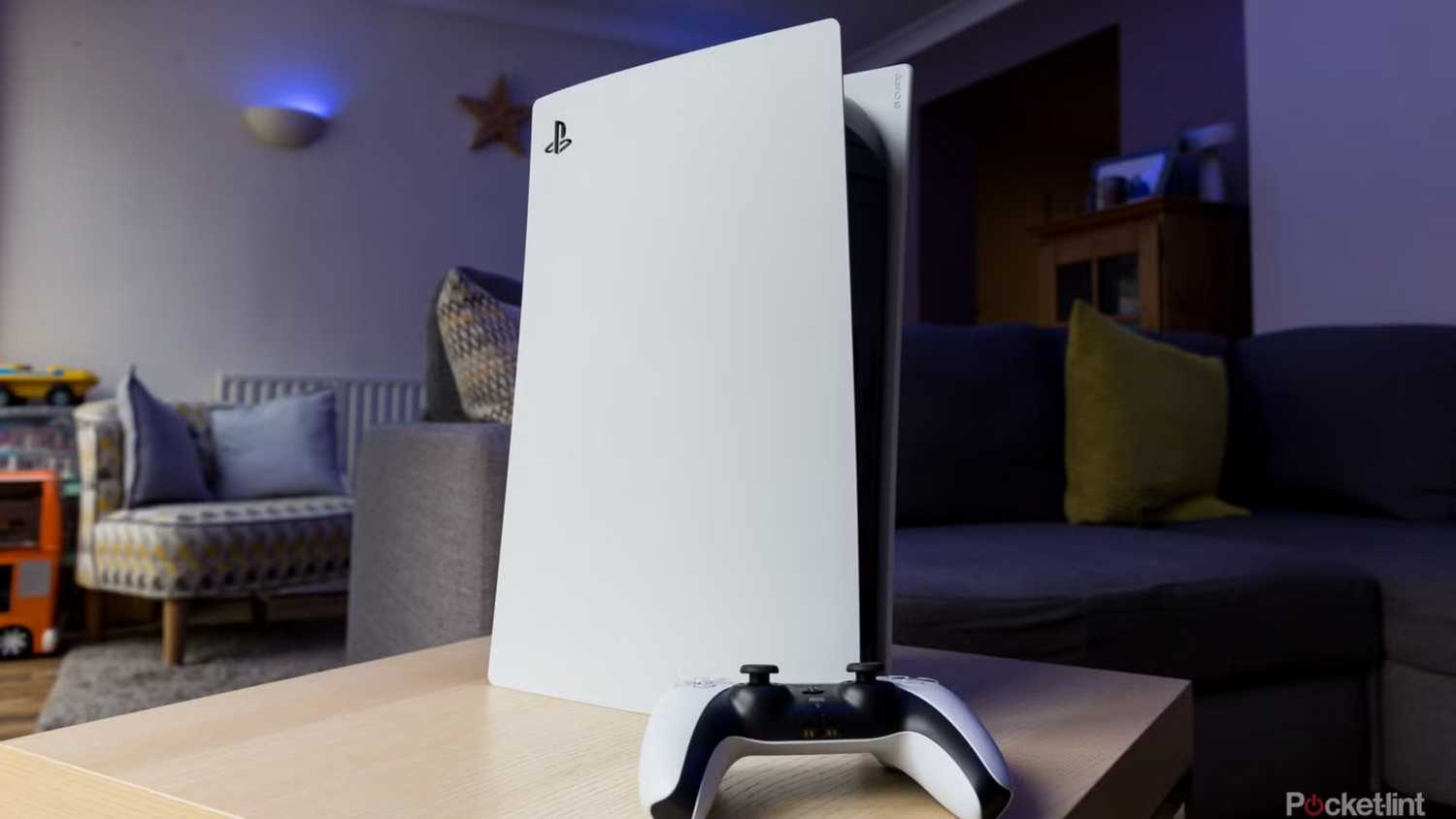 PS5 stood vertically on a table.