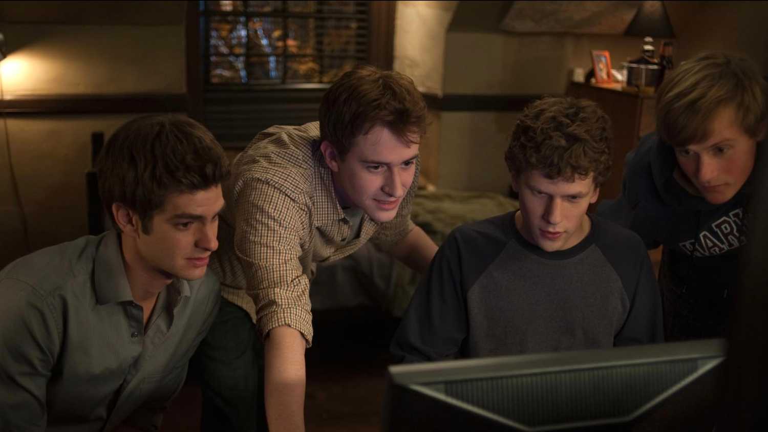 Andrew Garfield Joseph Mazzello Jesse Eisenberg and Patrick Mapel in The Social Network 