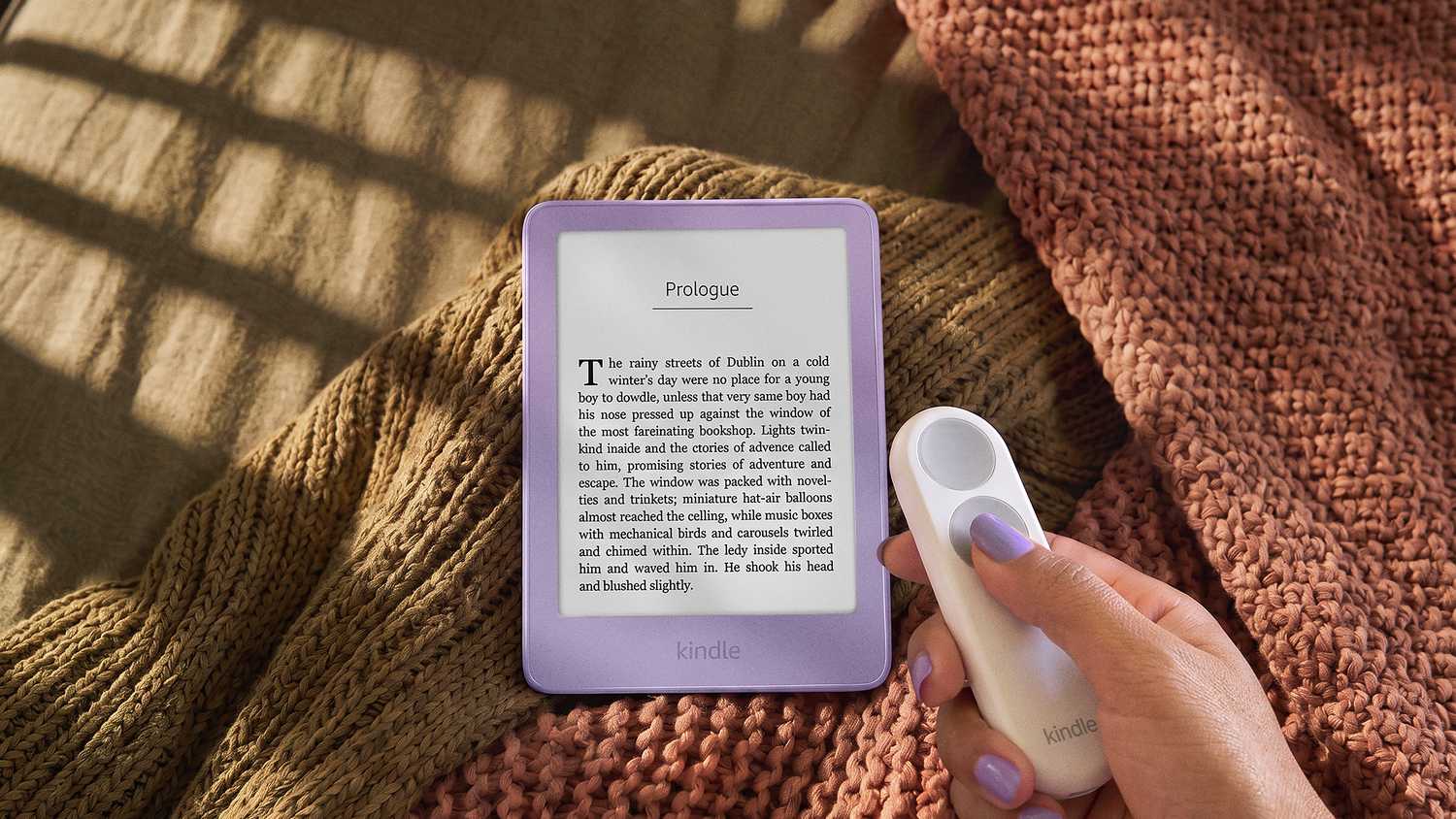 The Kindle Click accessory next to a Kindle by Amazon.