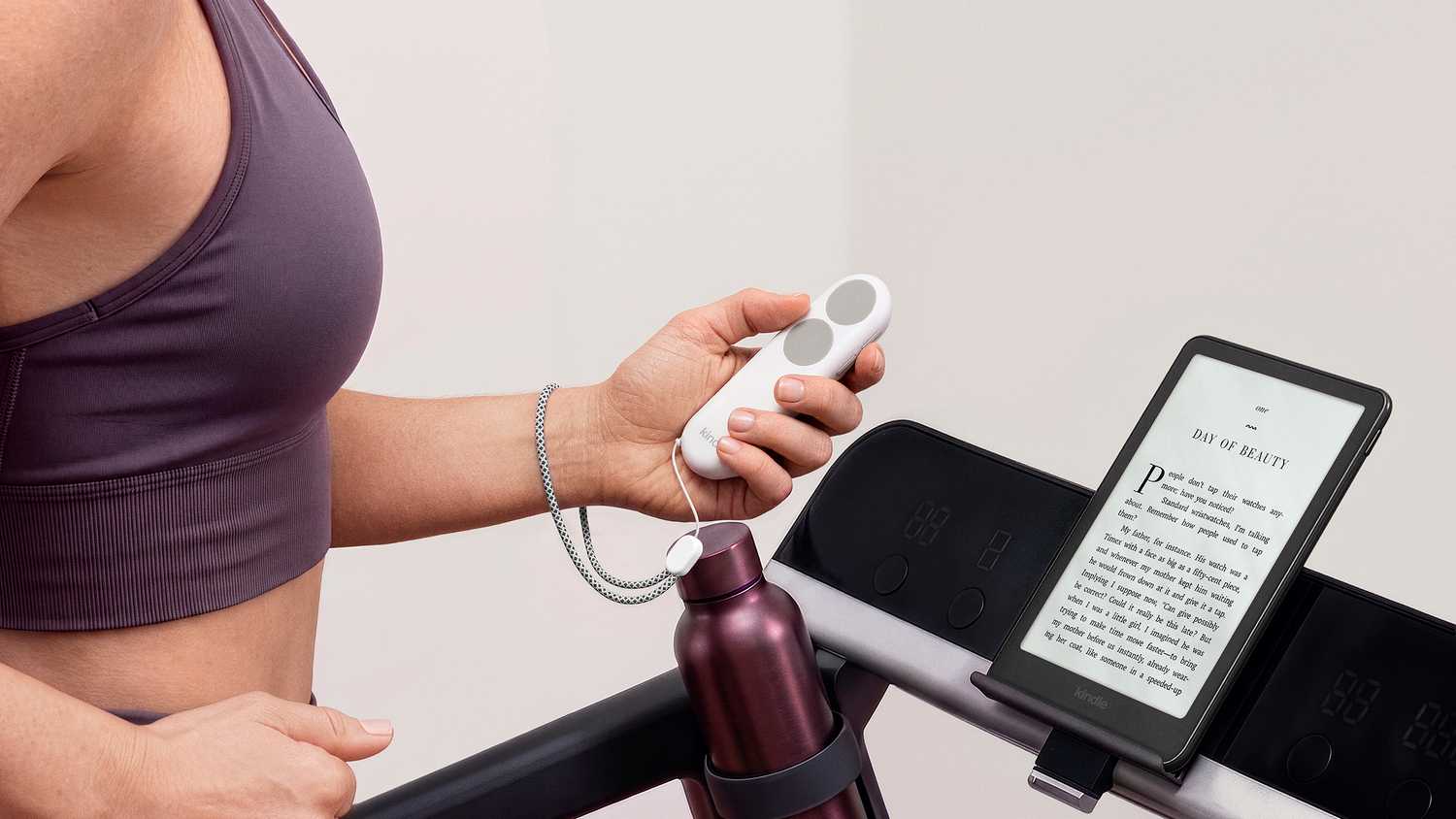 Kindle Click Promotion image of woman using remote on treadmill for Kindle.