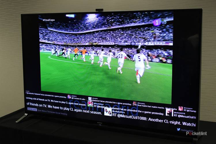 sony x9 4k tv featuring a soccer team running hand-in-hand across a pitch. 