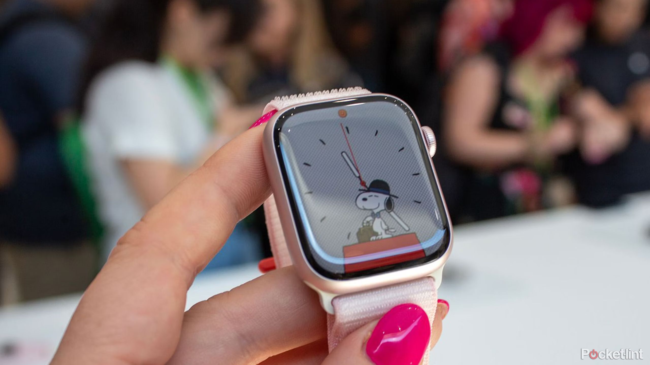 An Apple Watch Series 9 with the Snoopy watch face active.