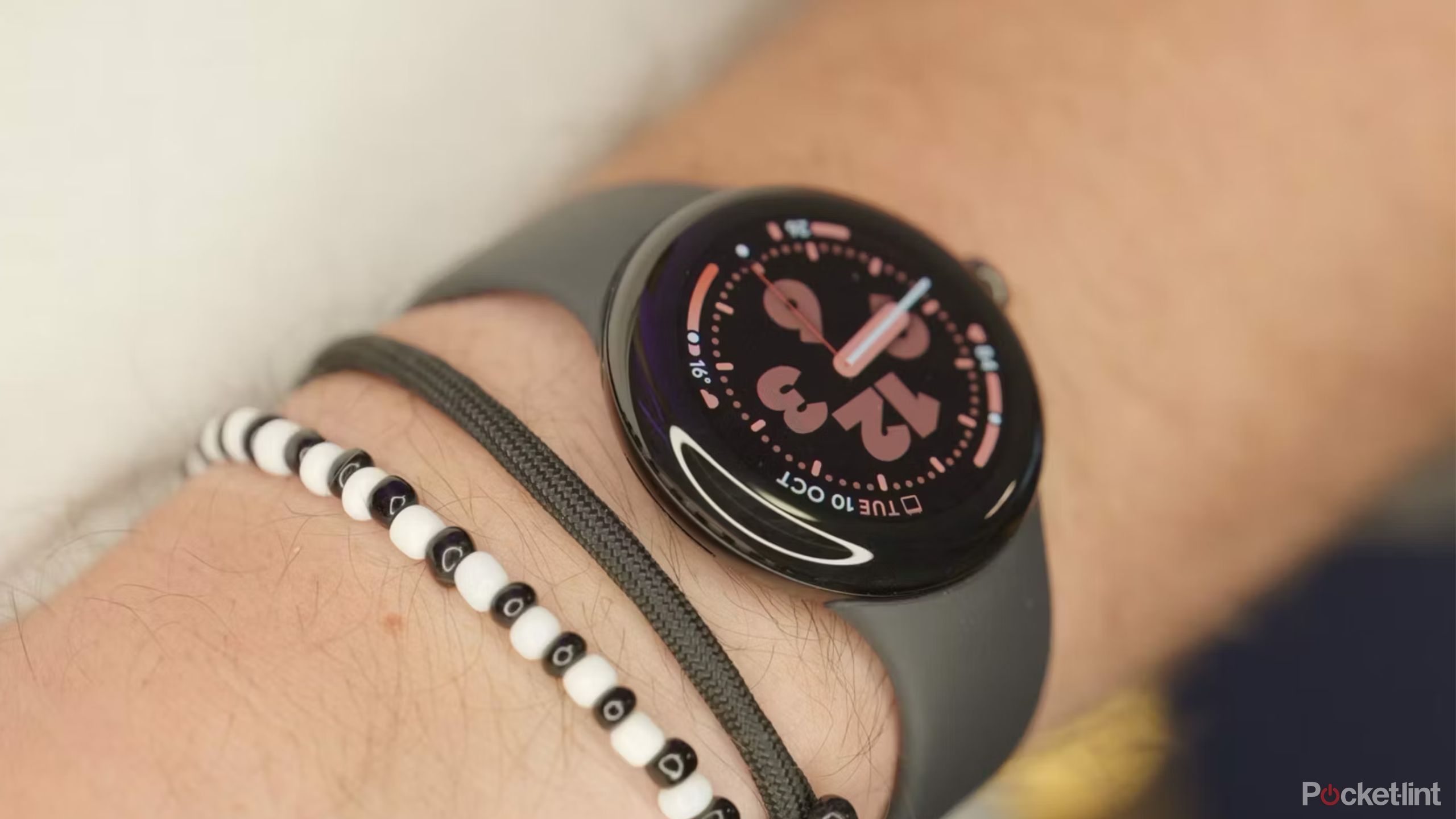 A Google Pixel Watch 2 on a wrist.