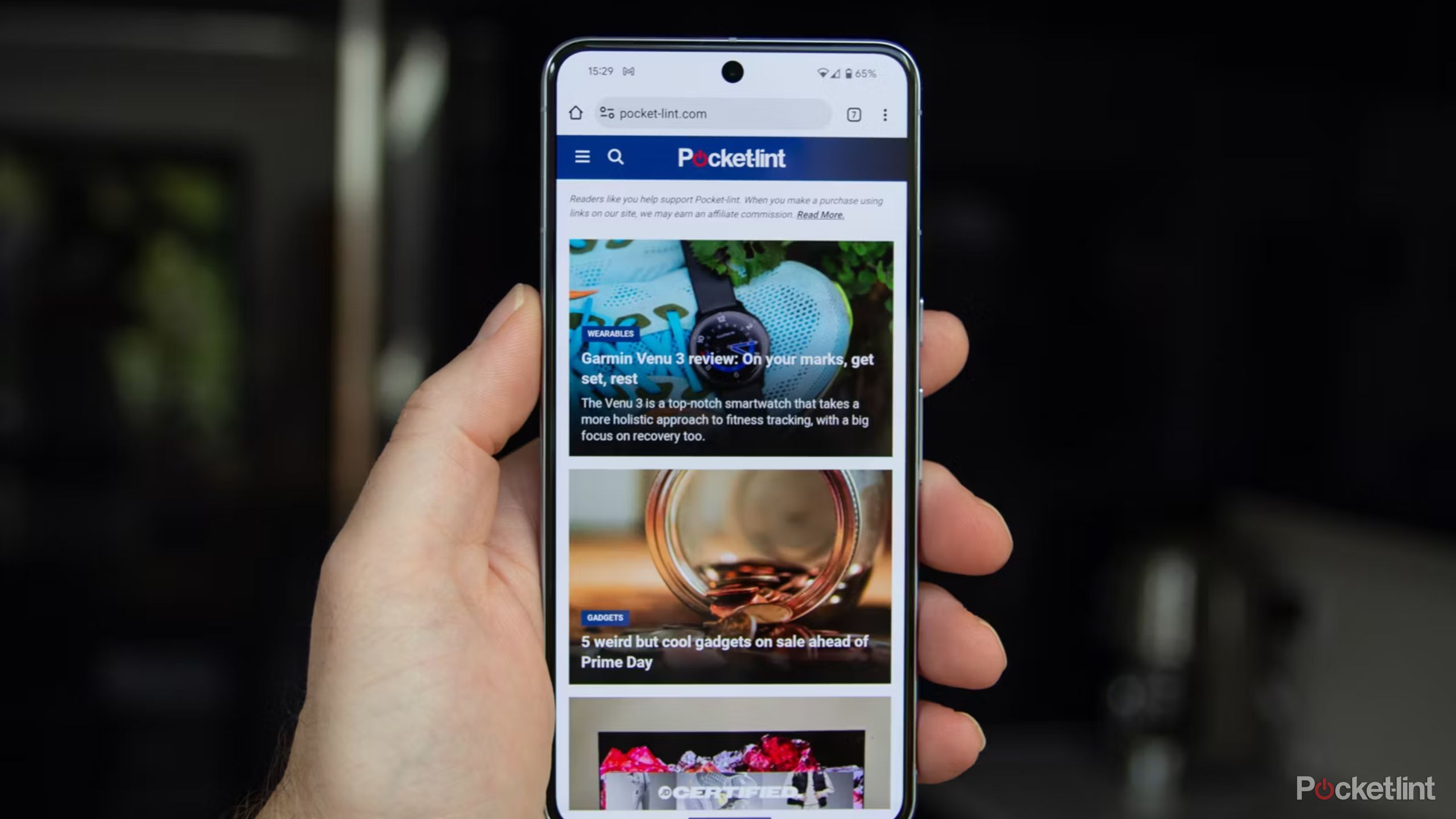 A person holding the Google Pixel 8 Pro 11. 